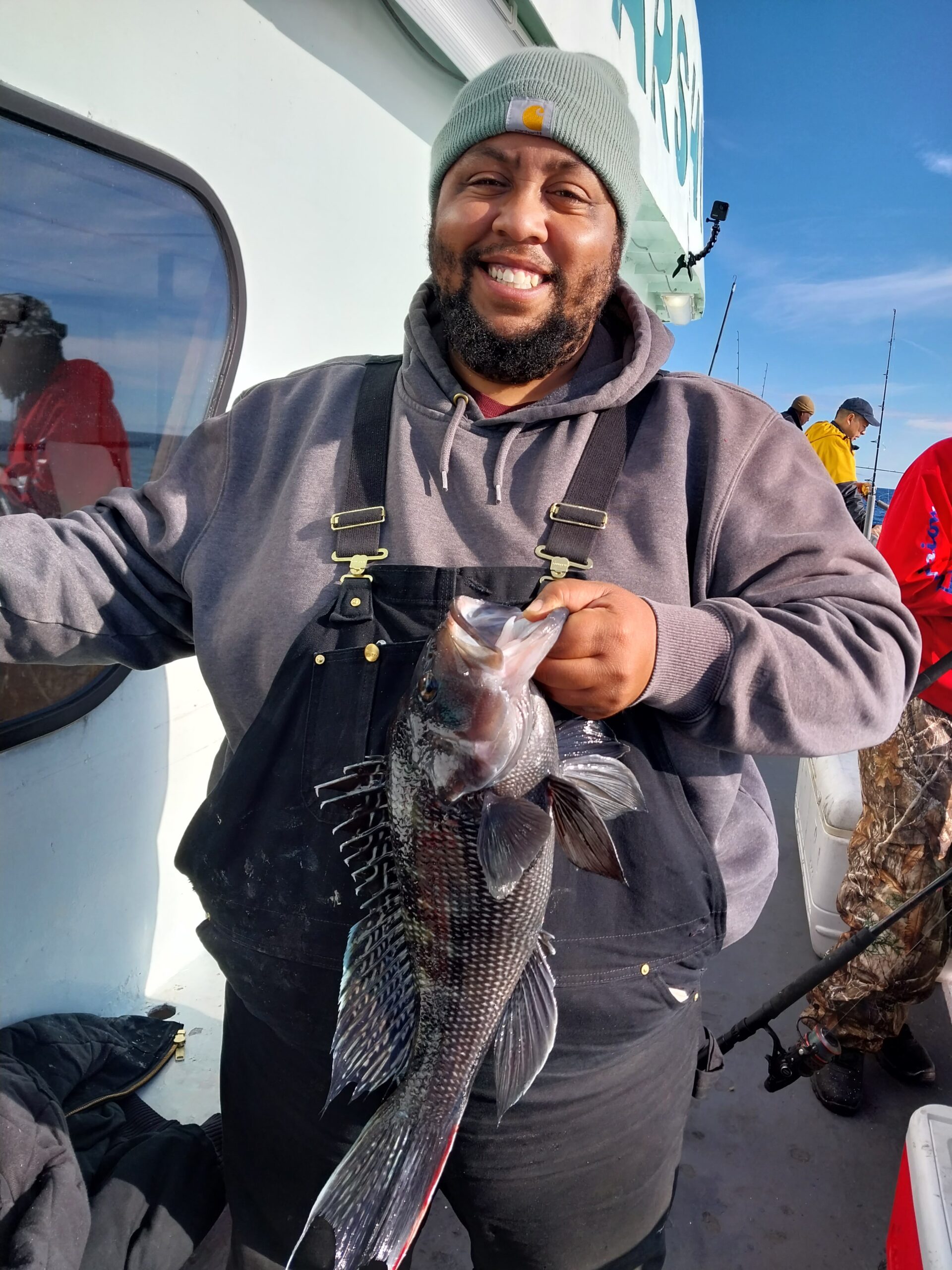 a man holding a fish
