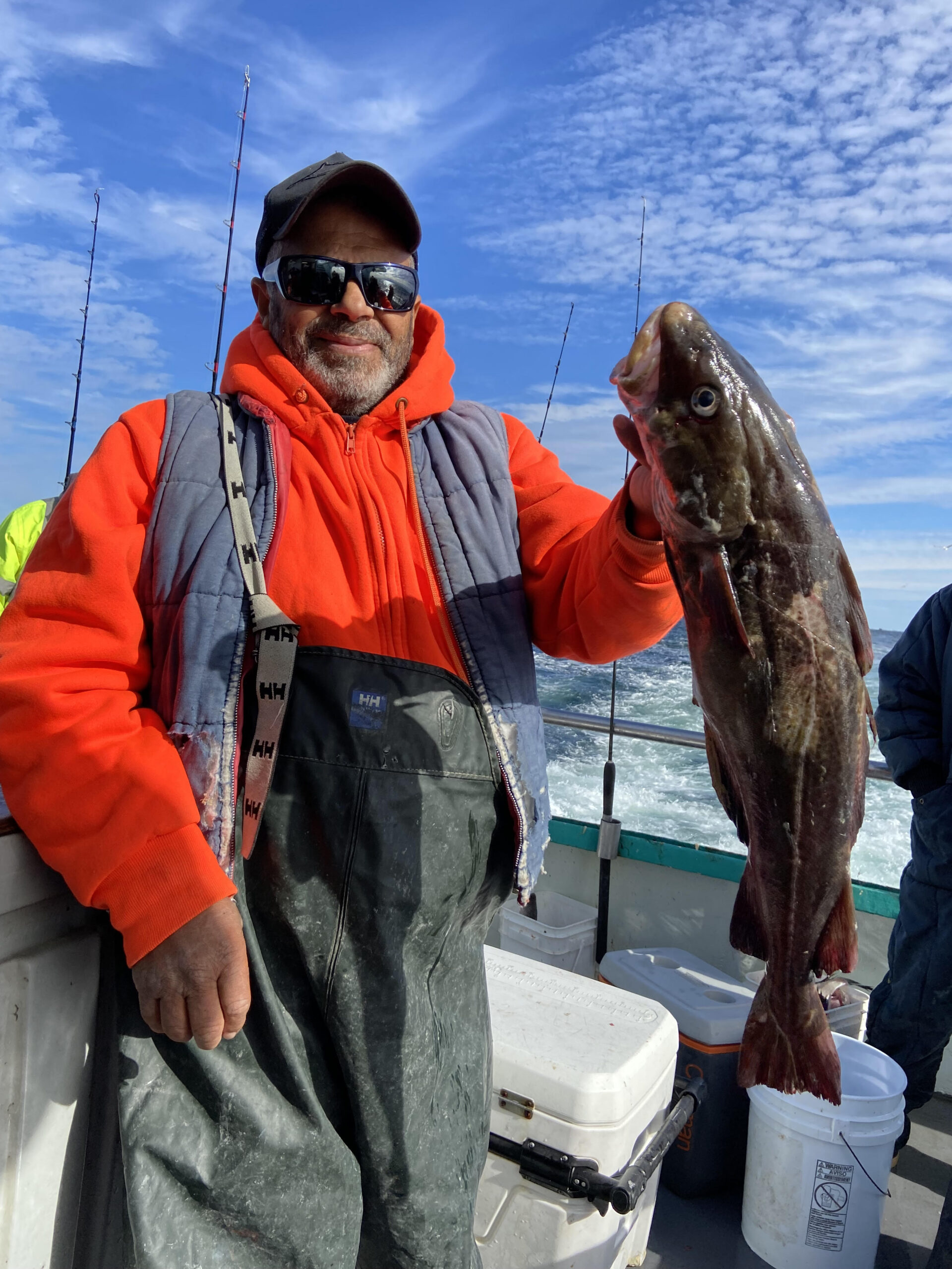 a man holding a fish
