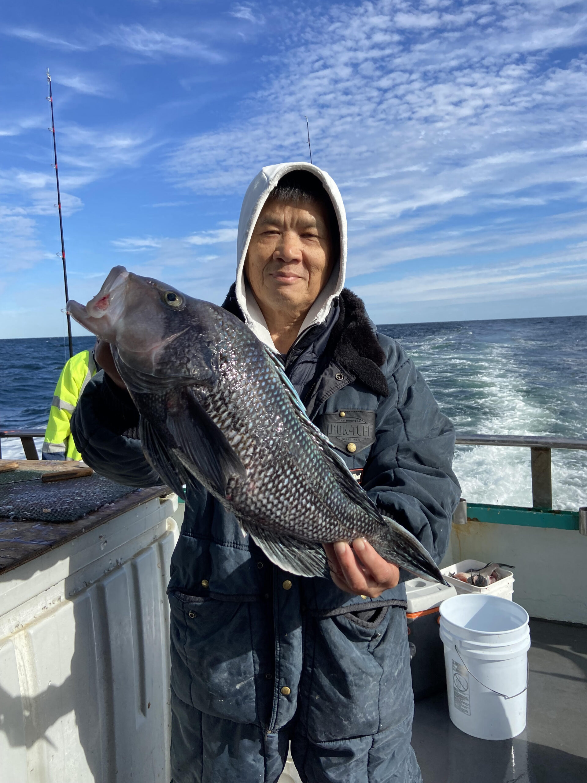 a person holding a fish in the water