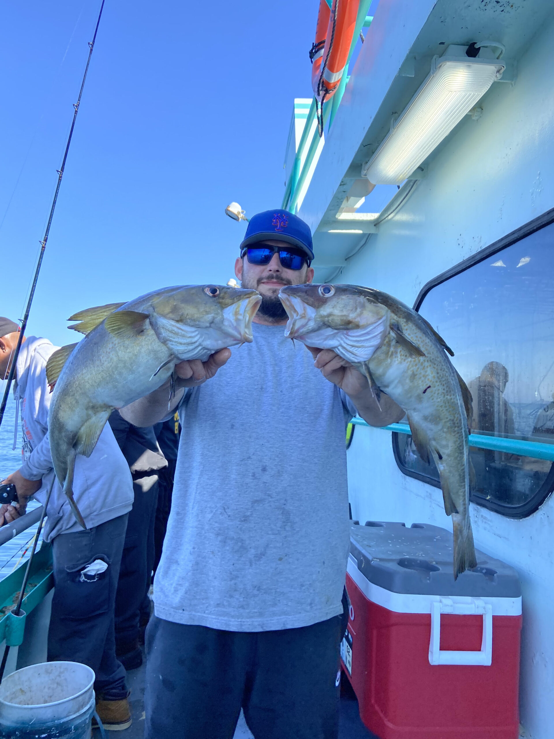 a person holding a fish