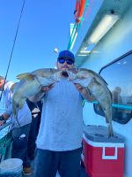 a person holding a fish