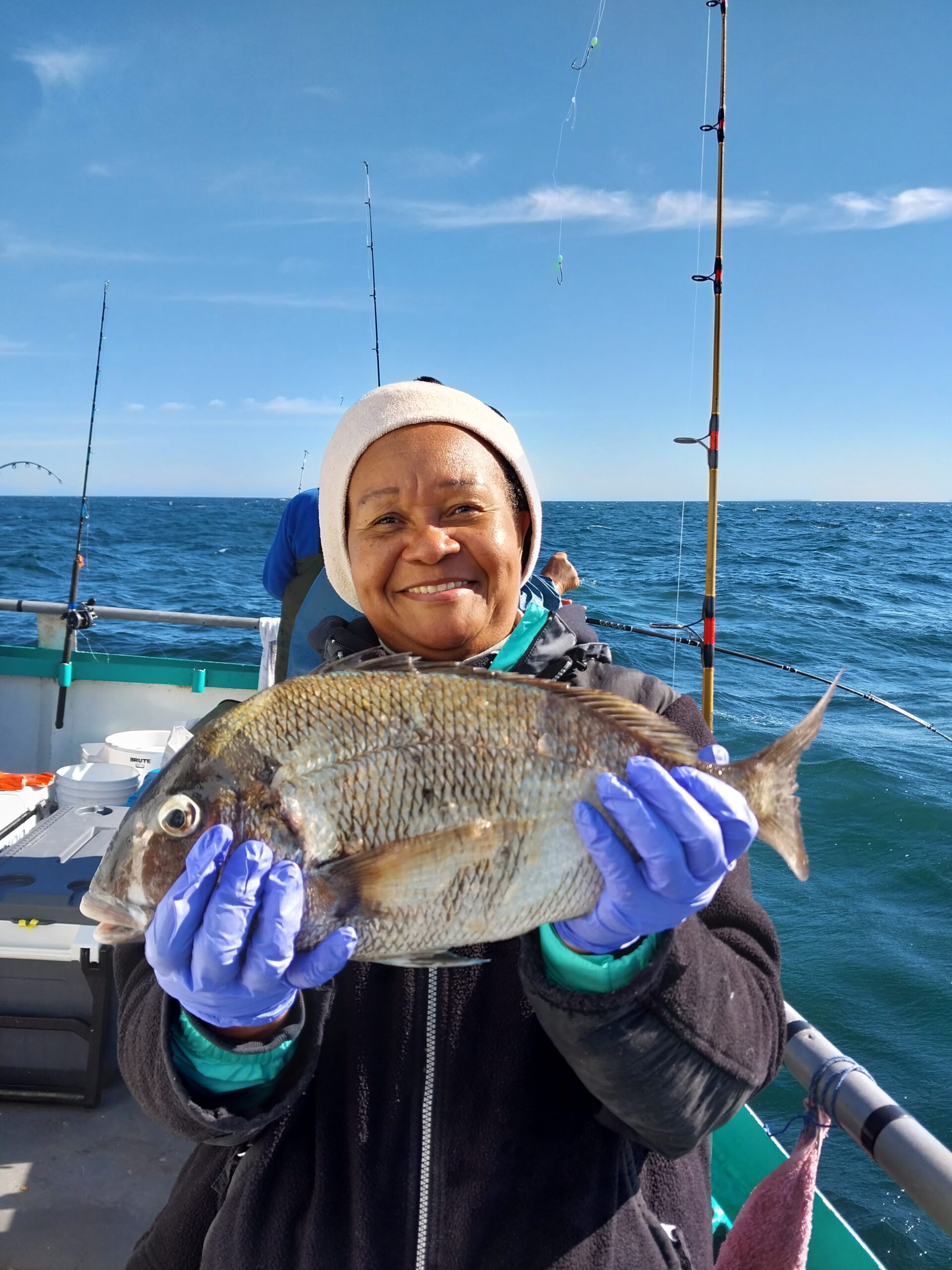 a person holding a fish in the water
