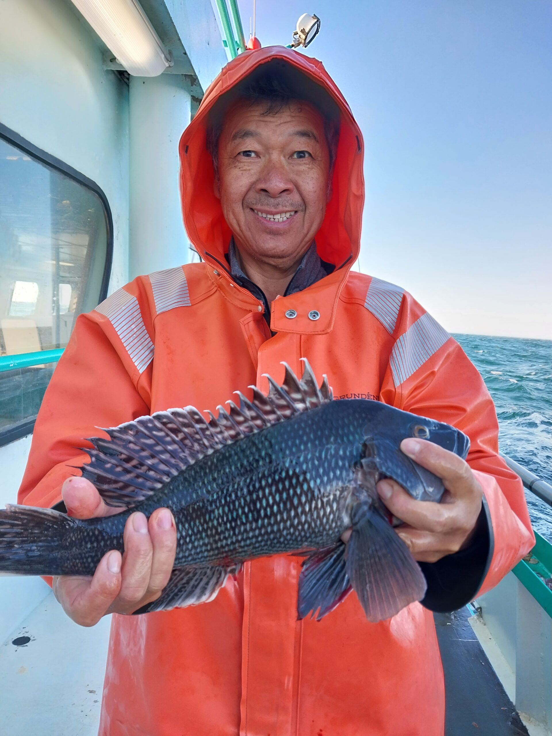 a person holding a fish