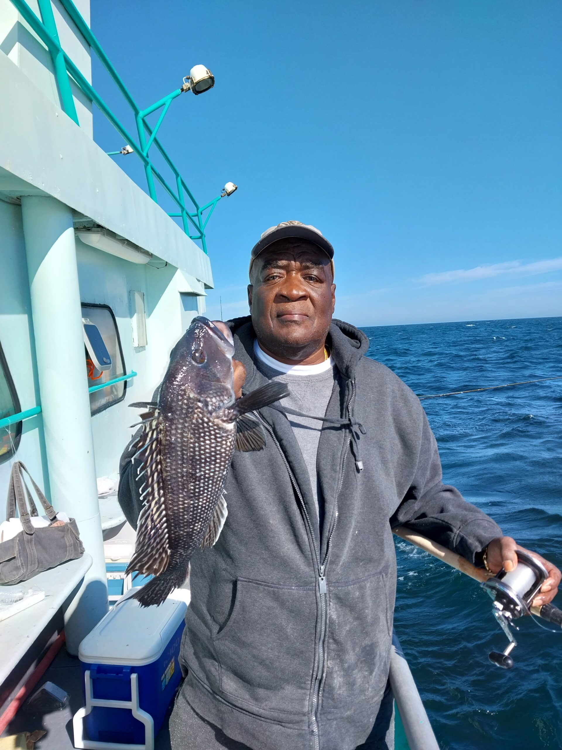 a man standing in front of water