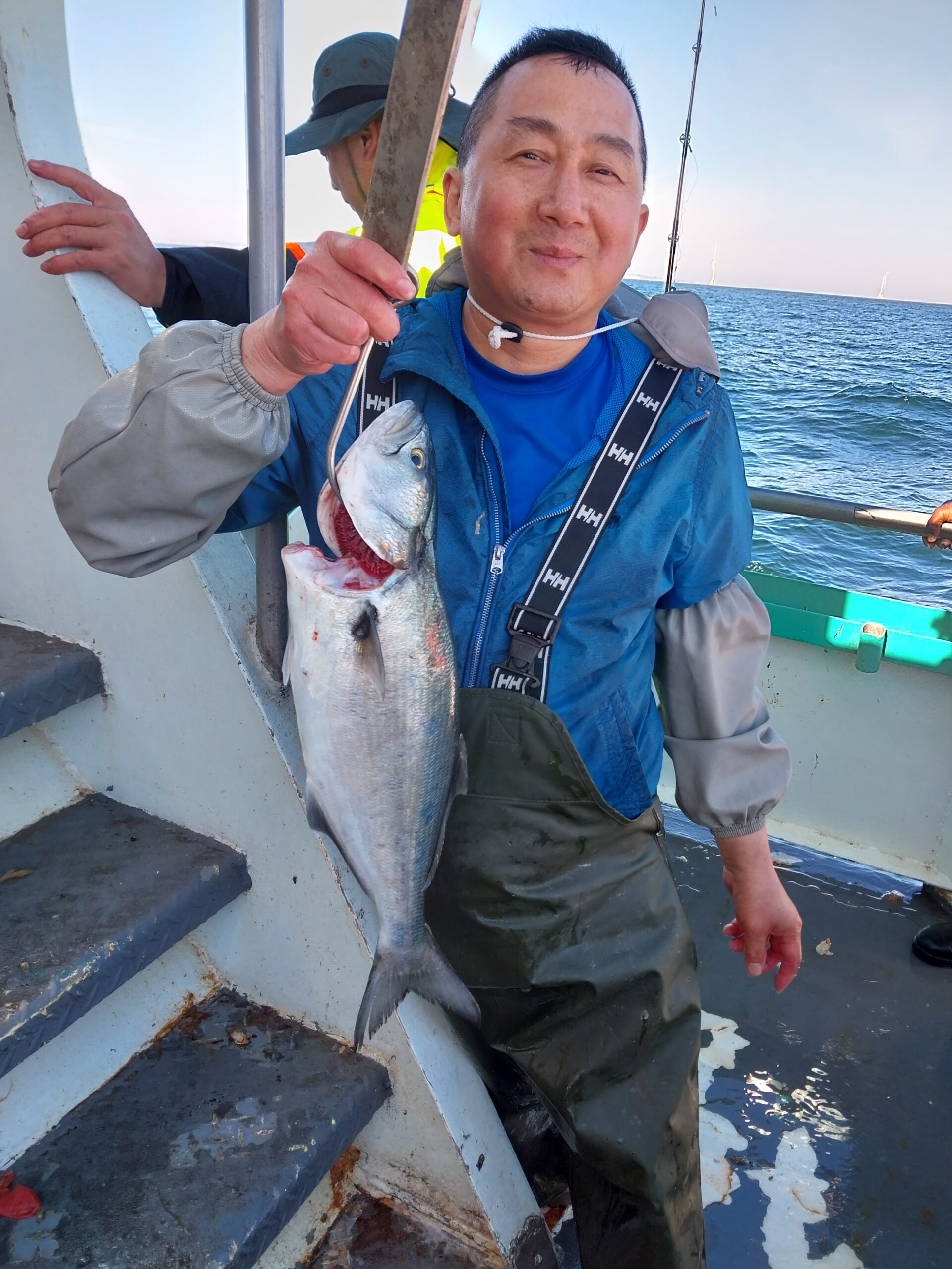 a man holding a fish