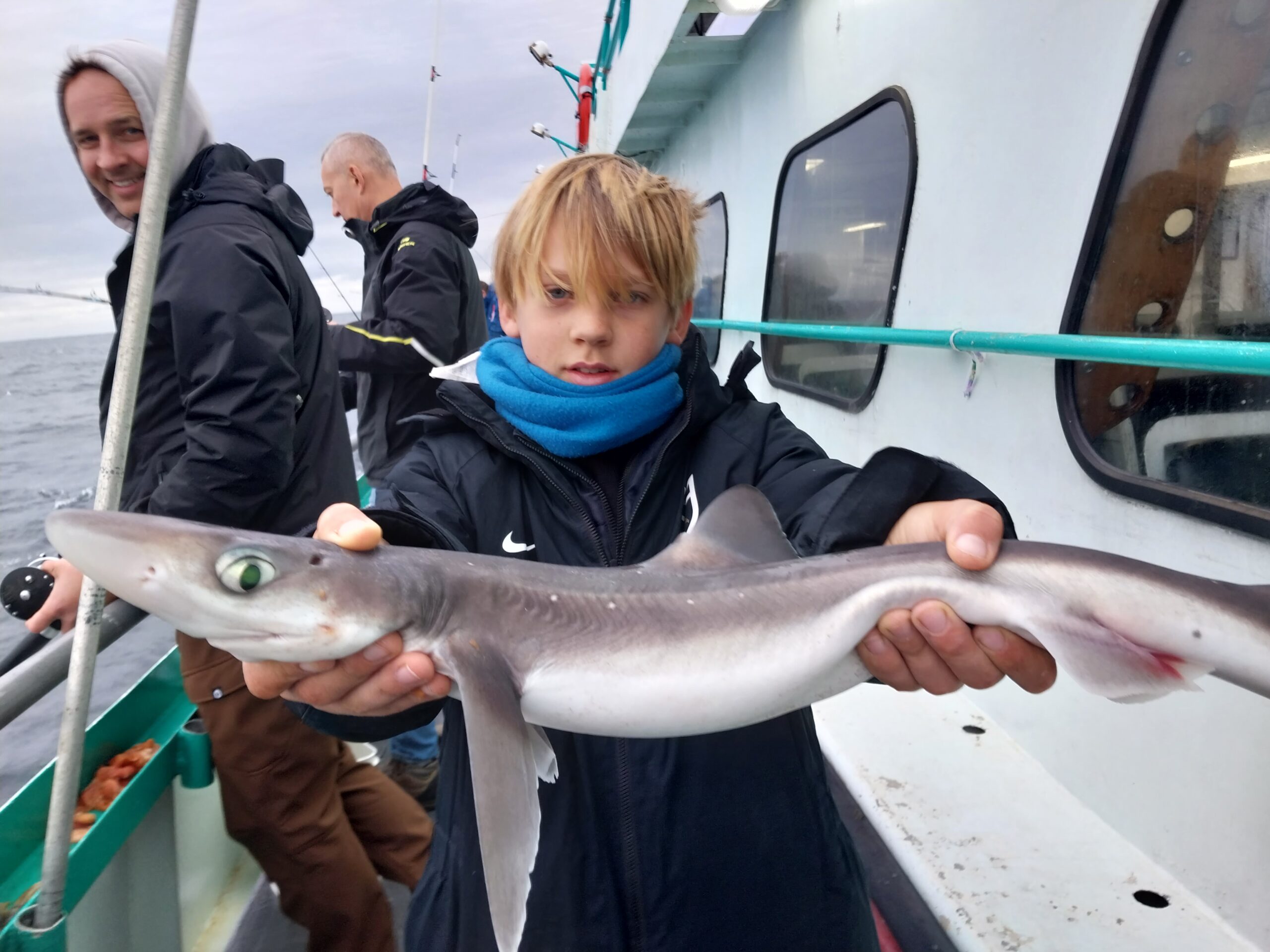 a person holding a fish