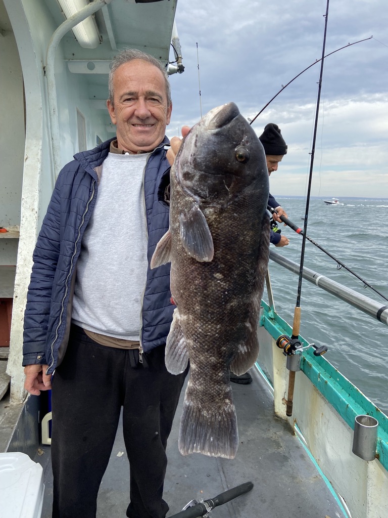 a person holding a fish