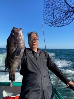 a person holding a fish in the water