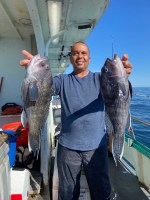 a person holding a fish