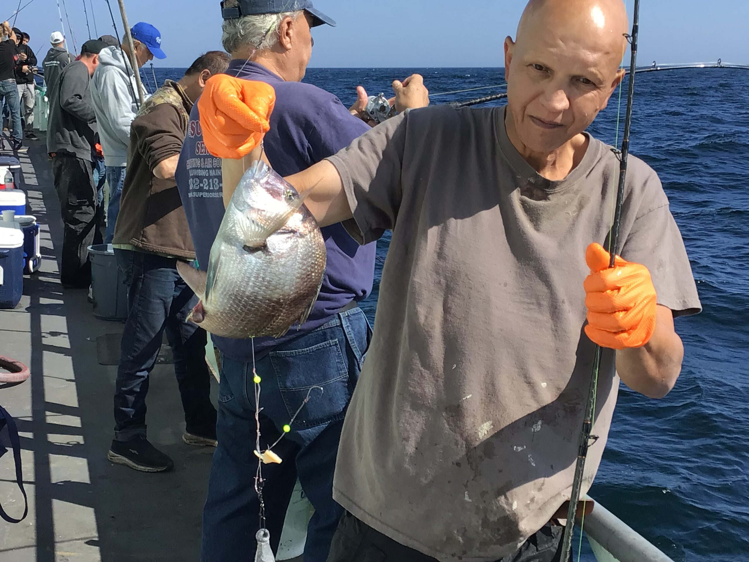 a man holding a fish in the water