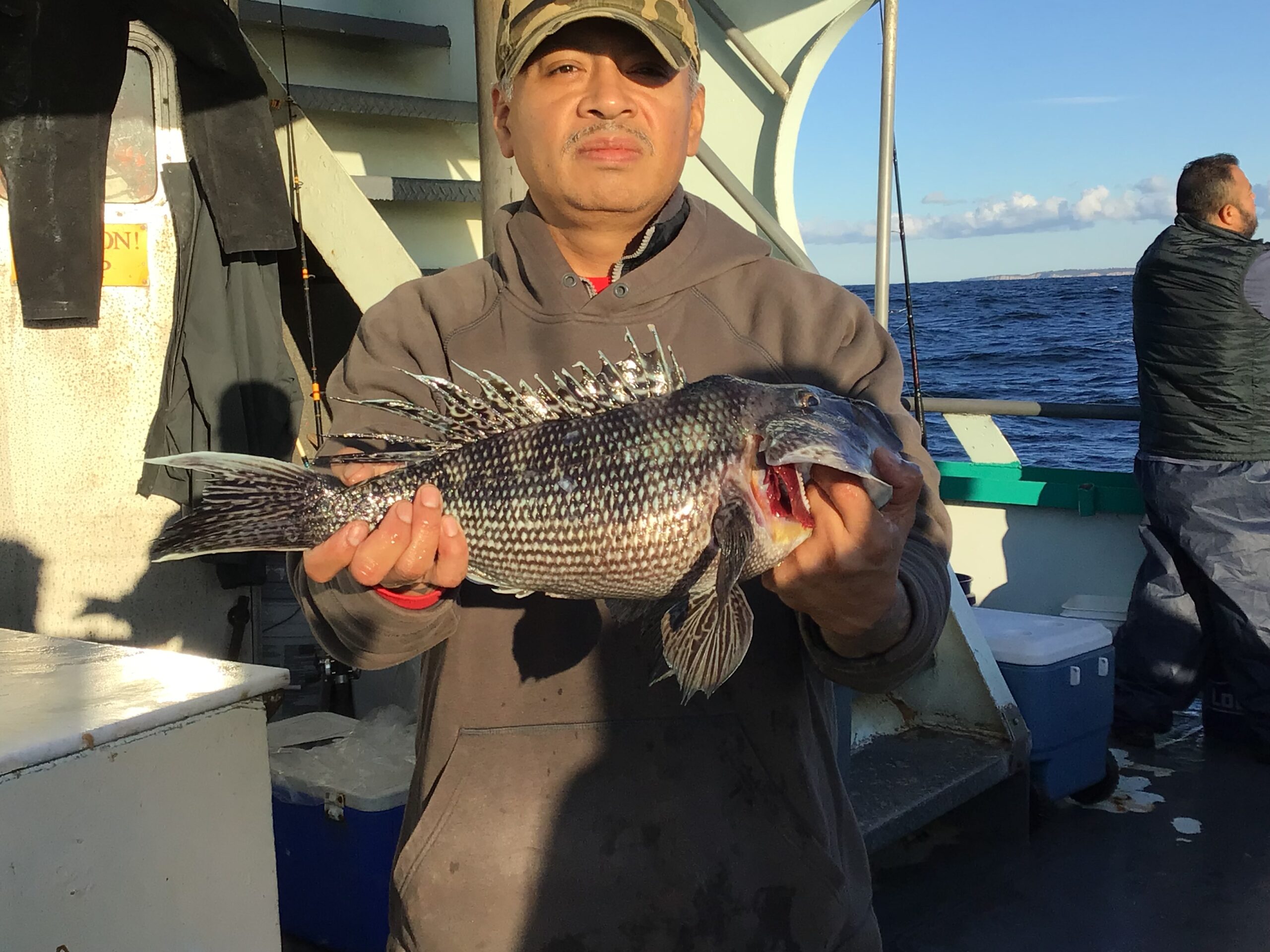 a person holding a fish