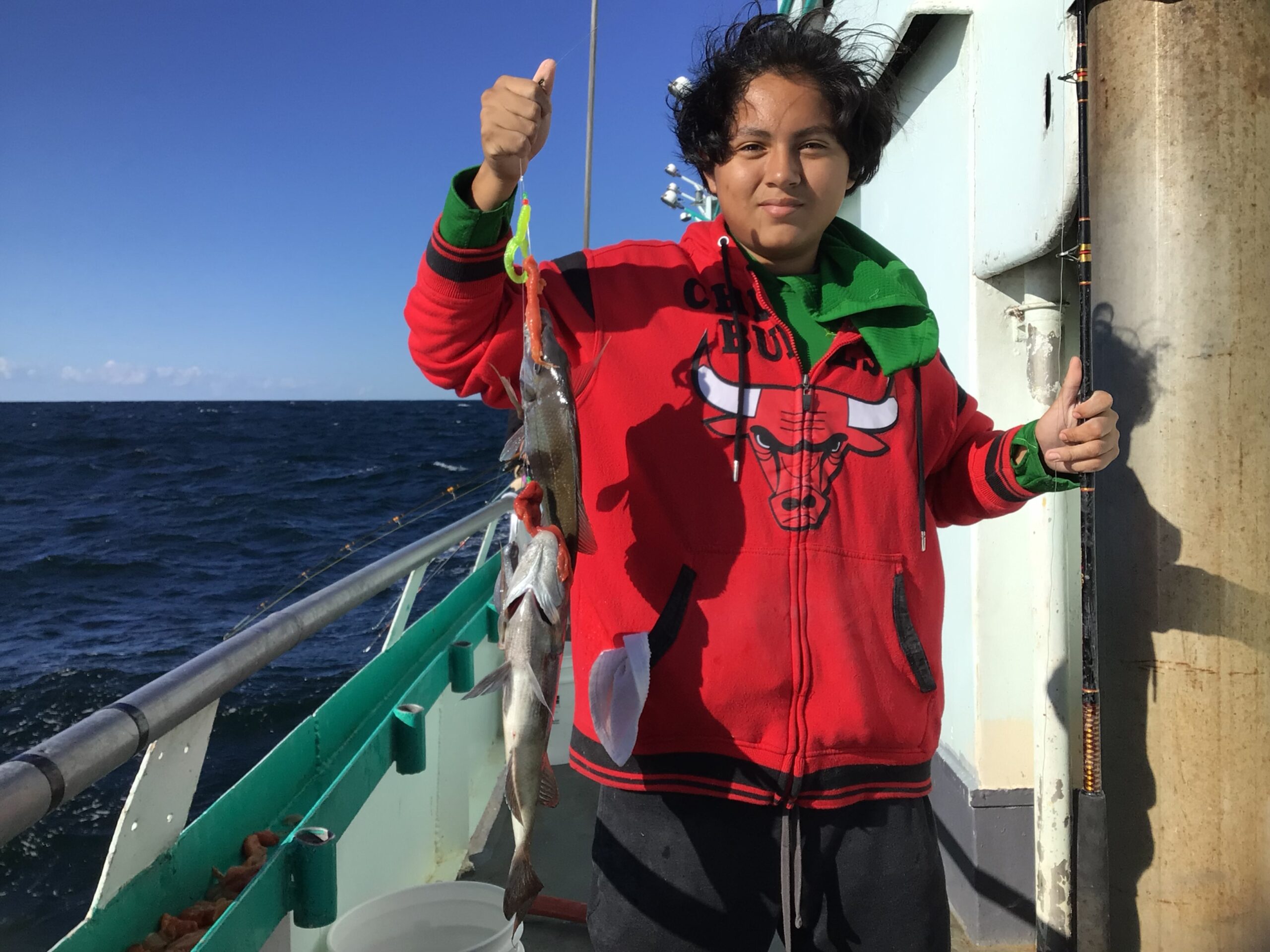 a little boy that is standing in the water