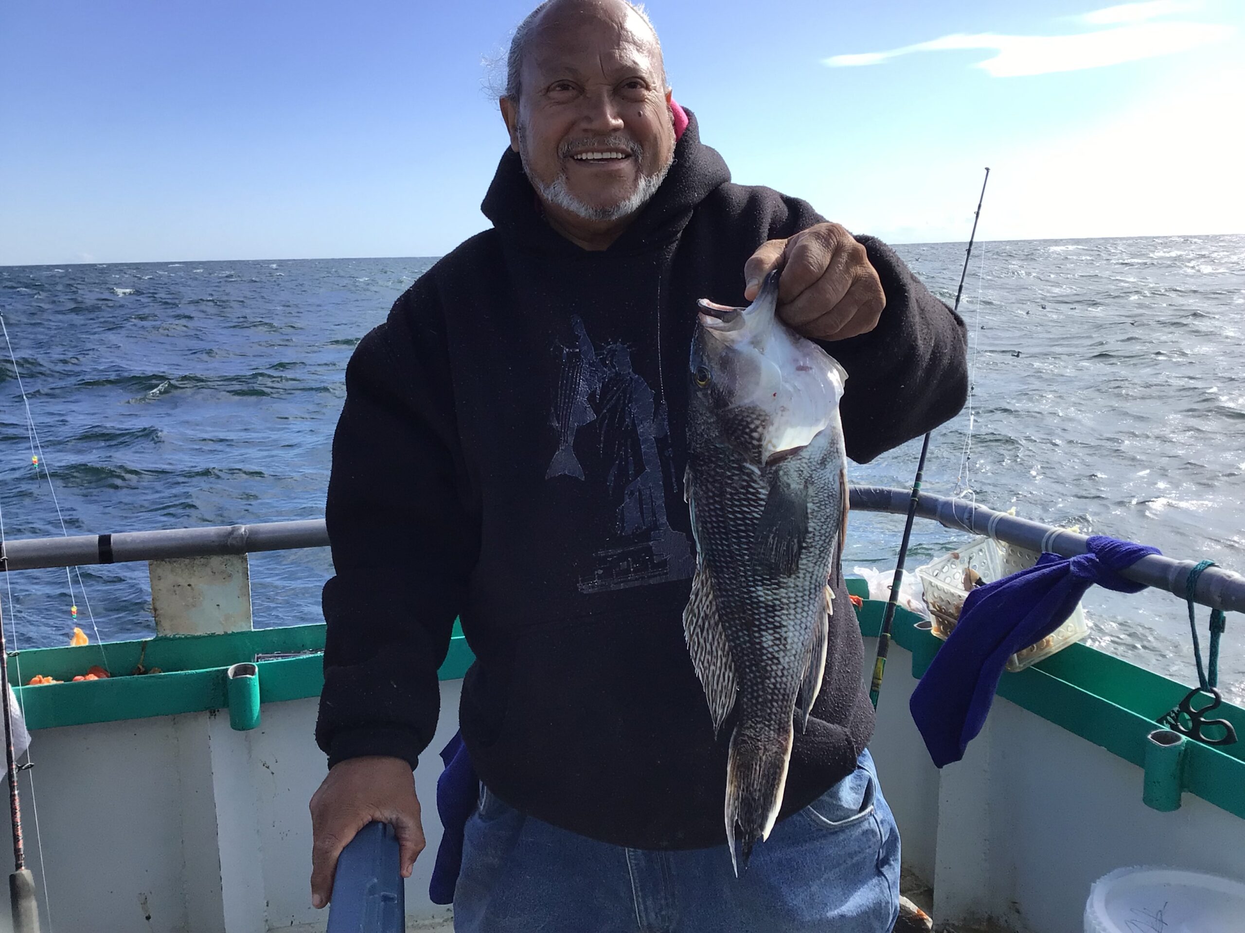 a person holding a fish in the water