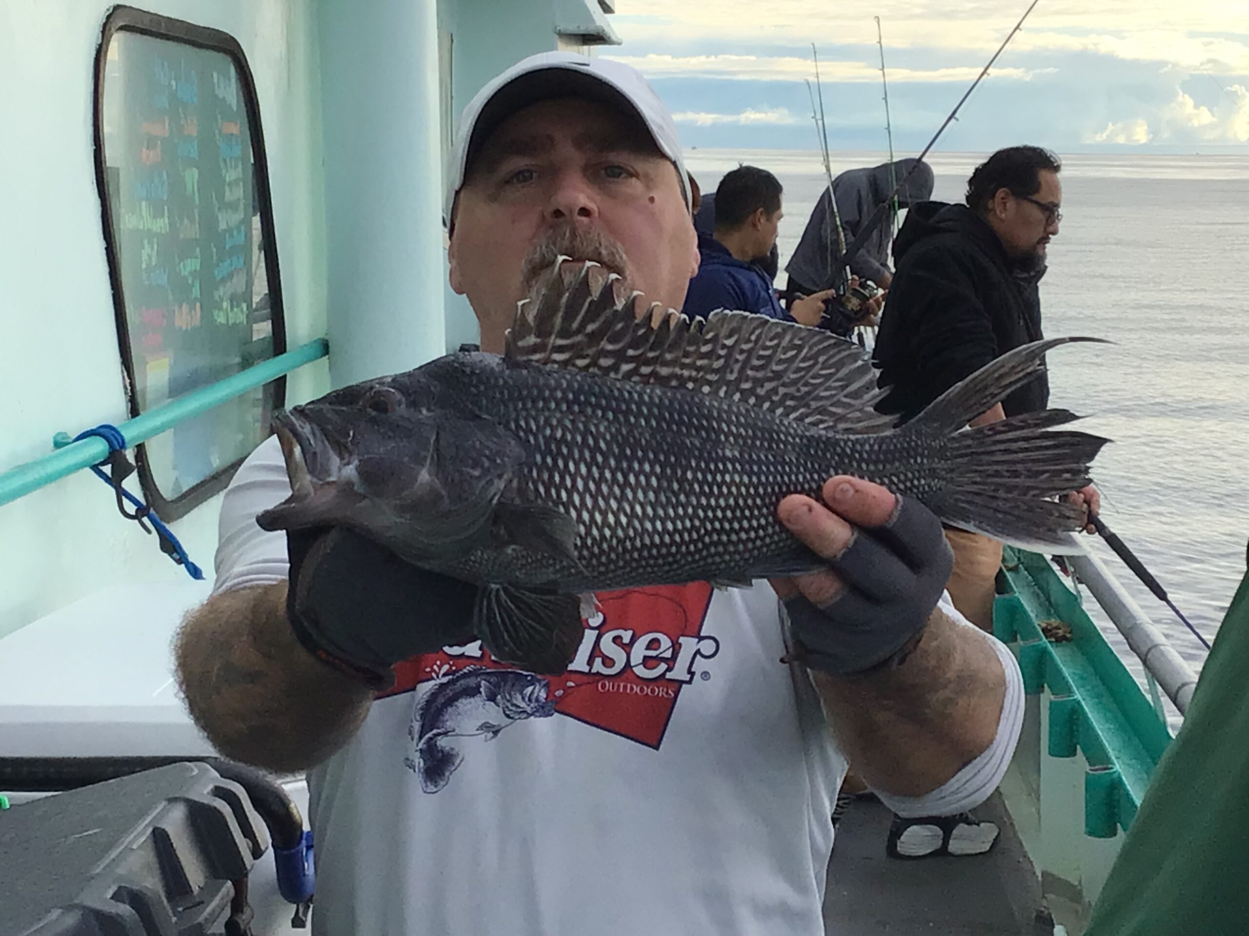 a man holding a fish