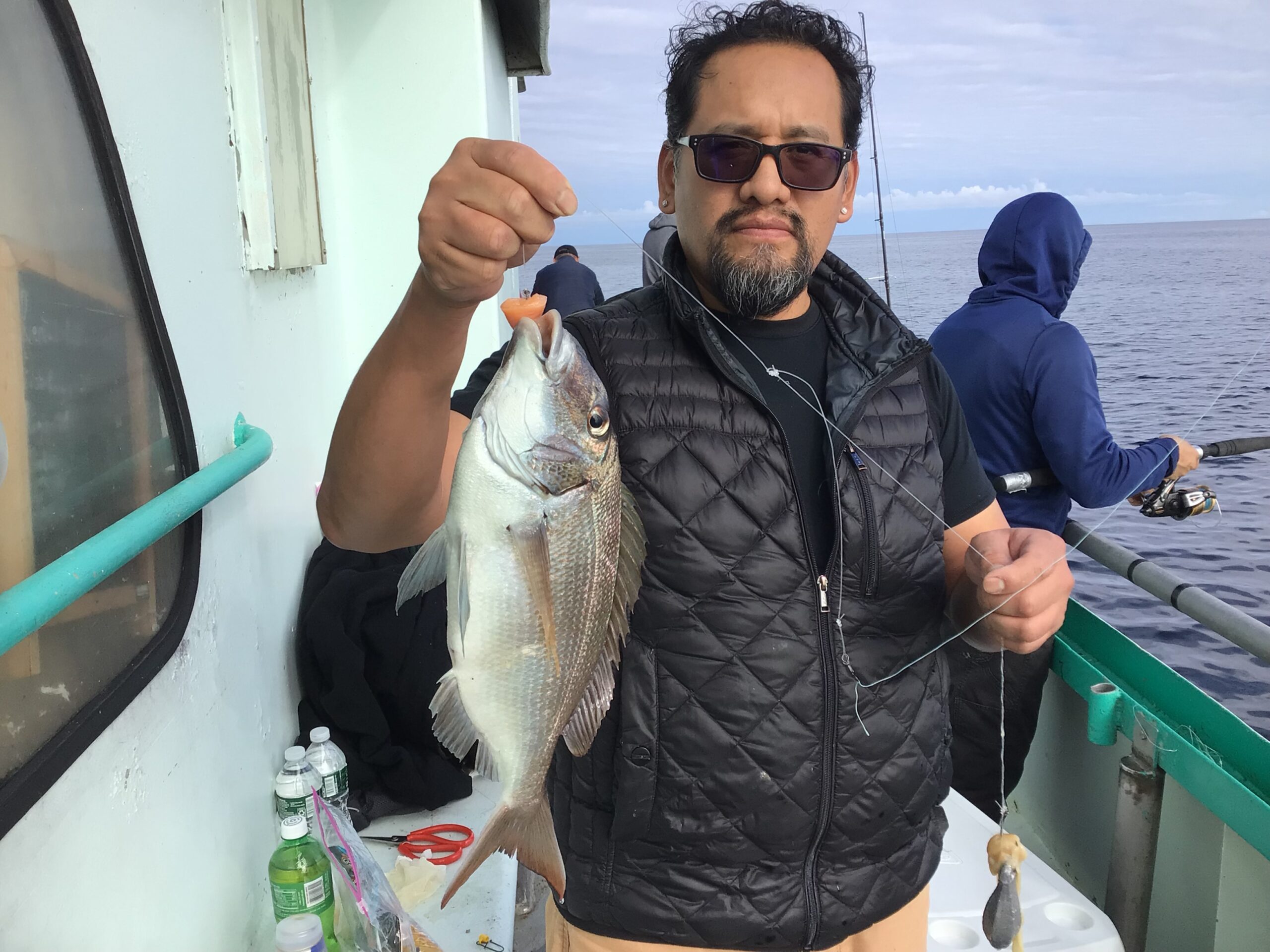 a man holding a fish