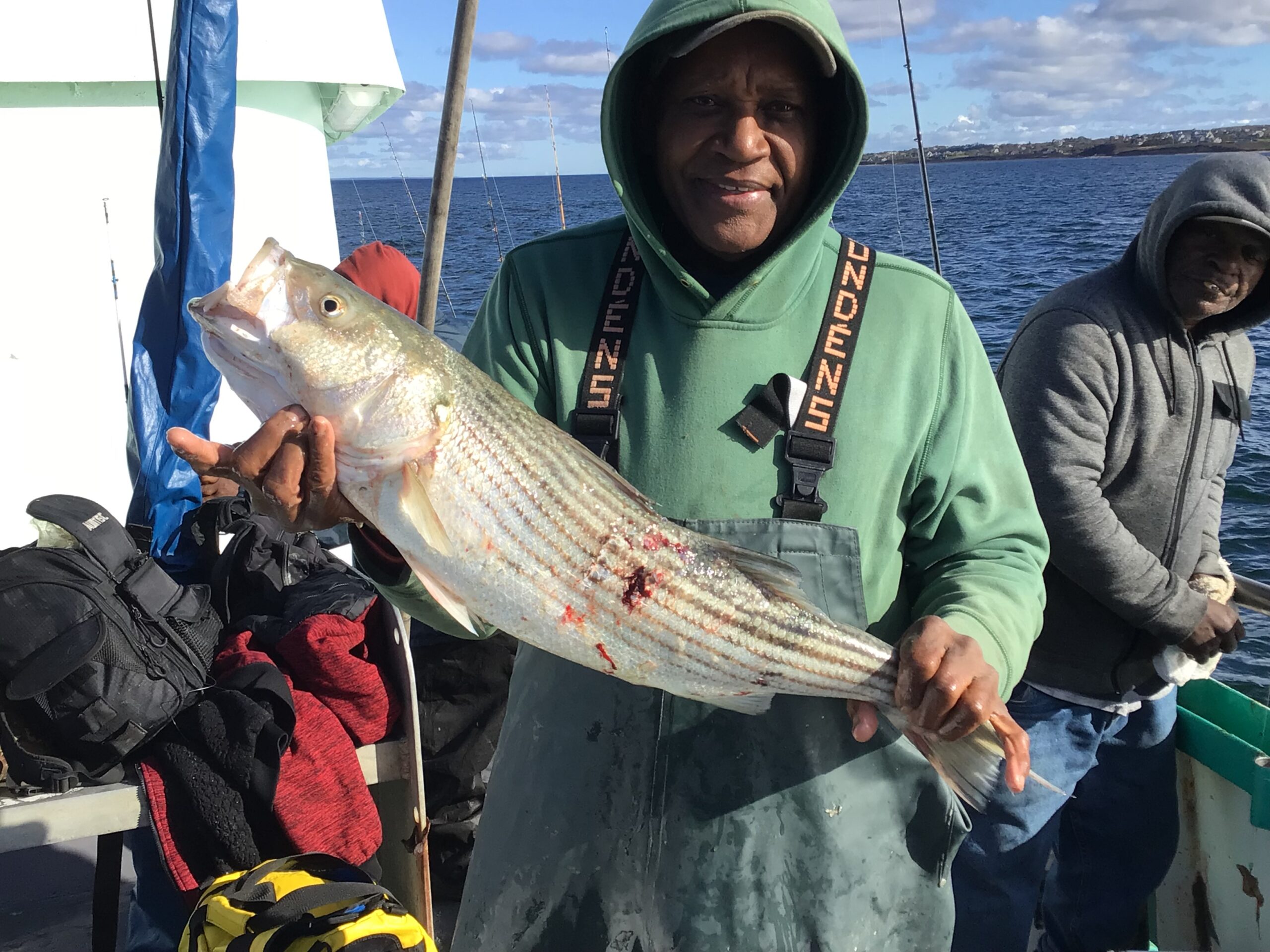 a person holding a fish in the water