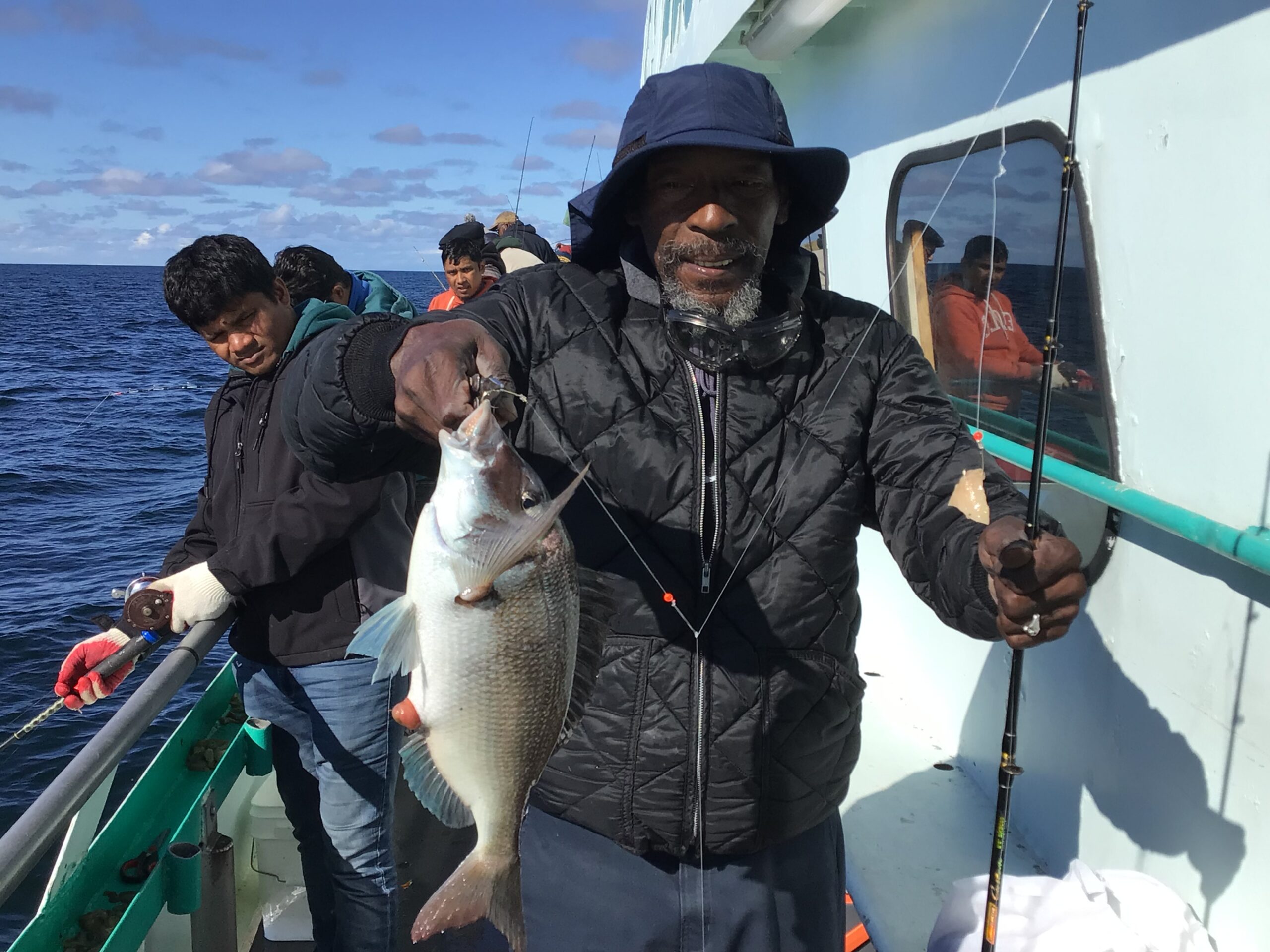 a person holding a fish