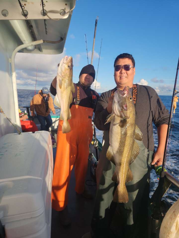 a person holding a fish