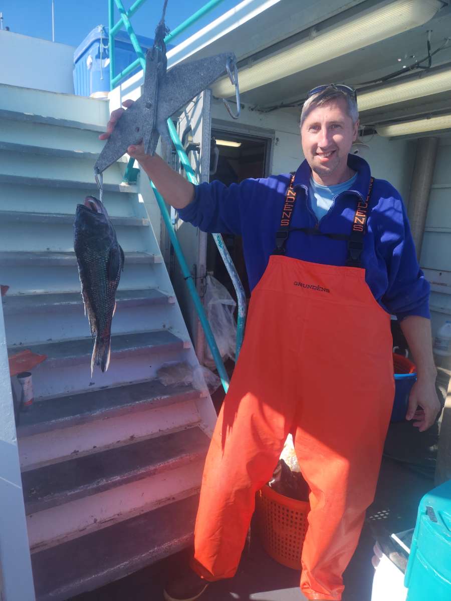 Bruce Blitz standing in front of a building
