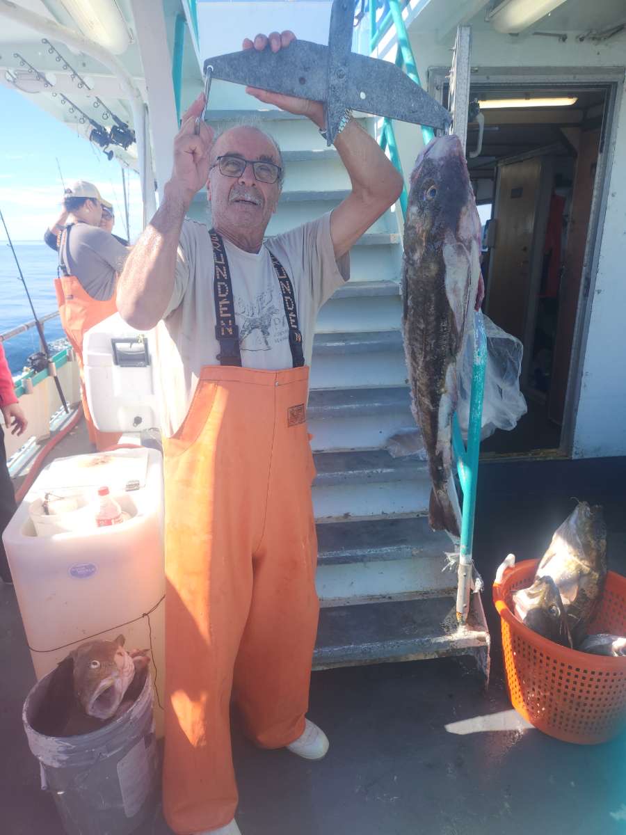 a man standing in front of a boat