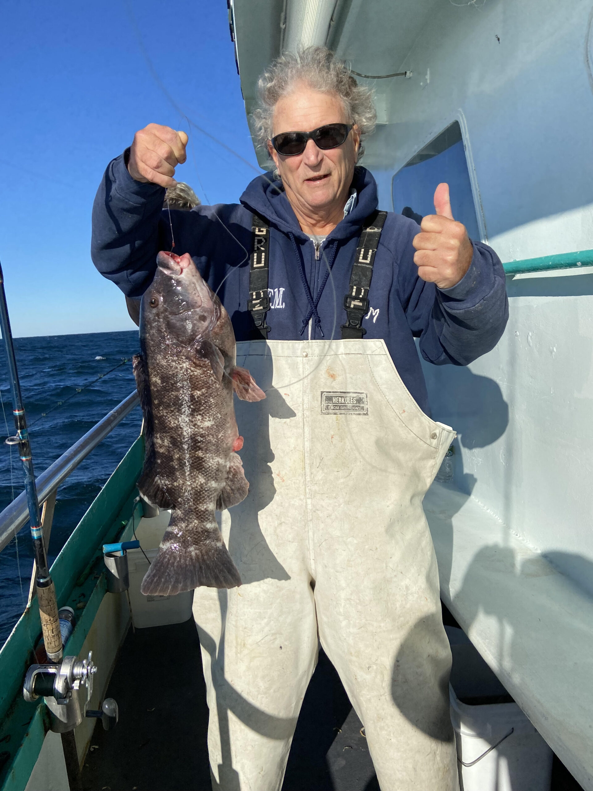 a man standing in front of a boat