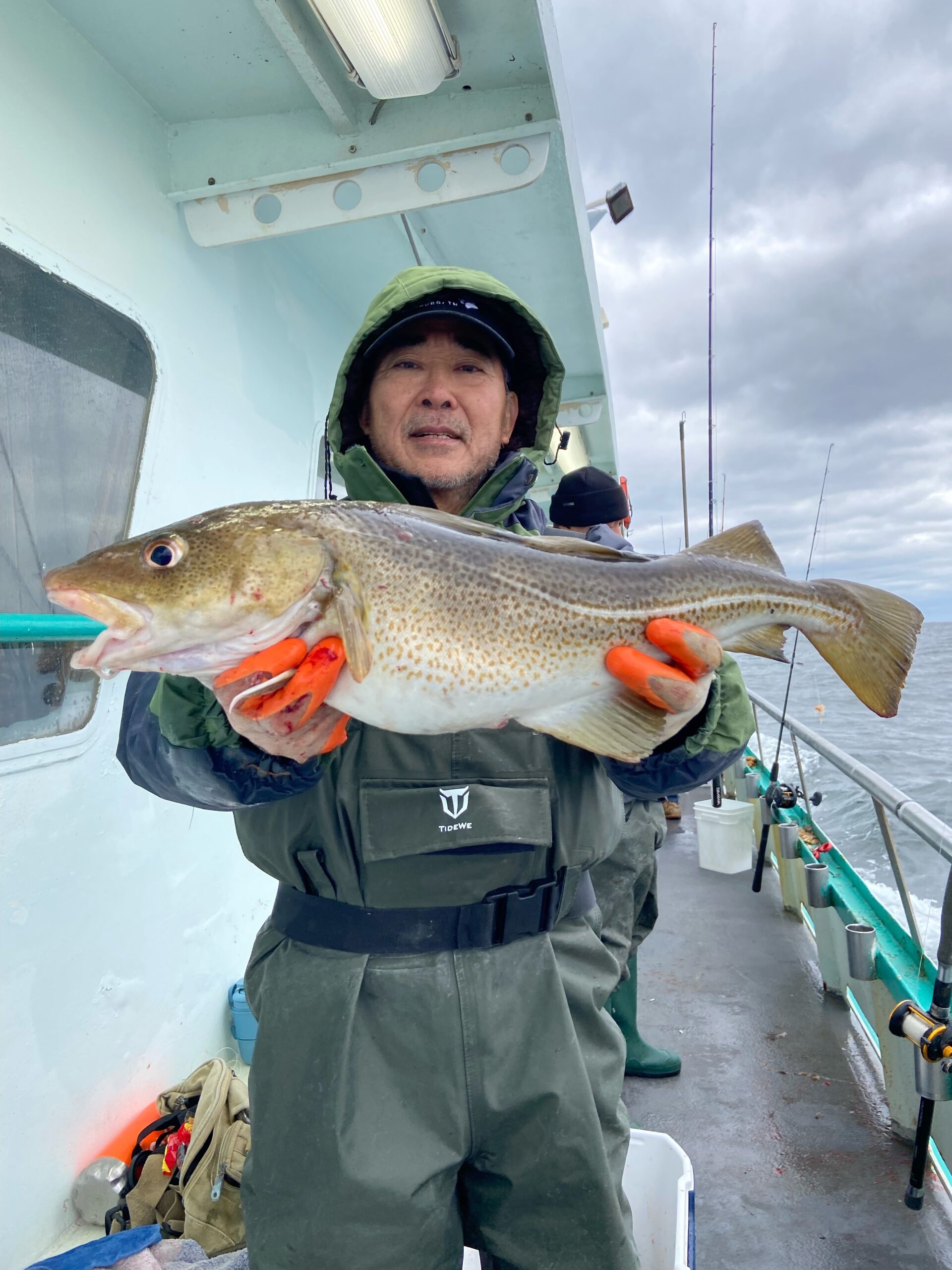 Kiyoshiro Imawano holding a fish
