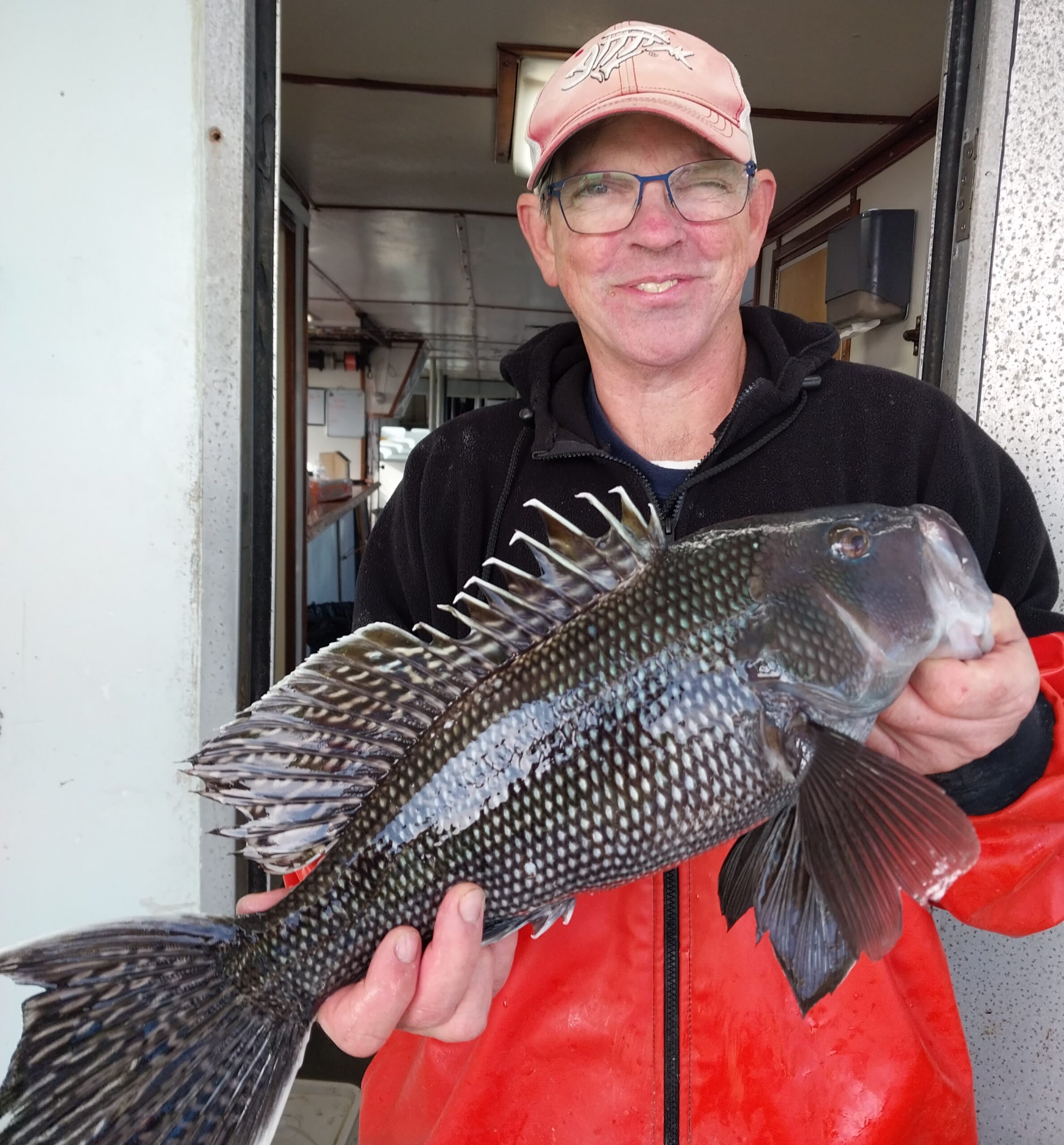 a man holding a fish