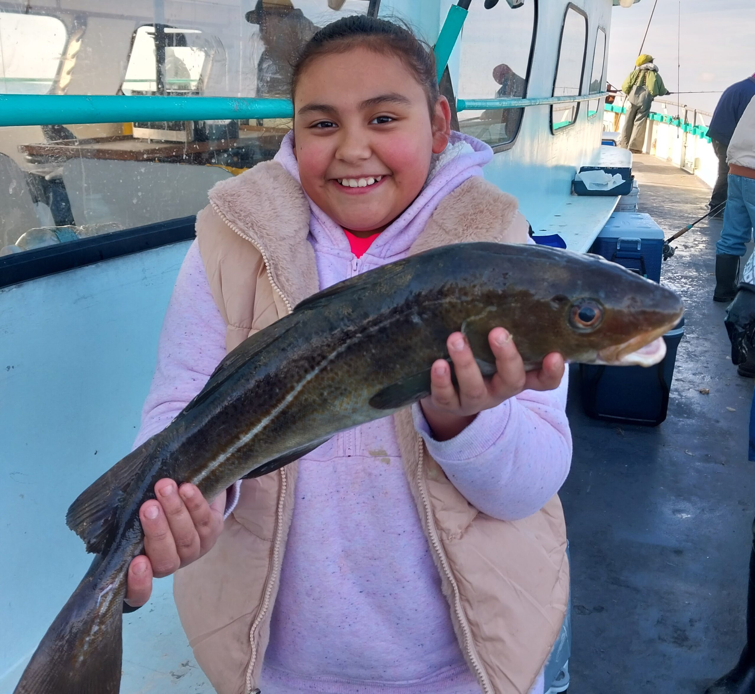 a person holding a fish