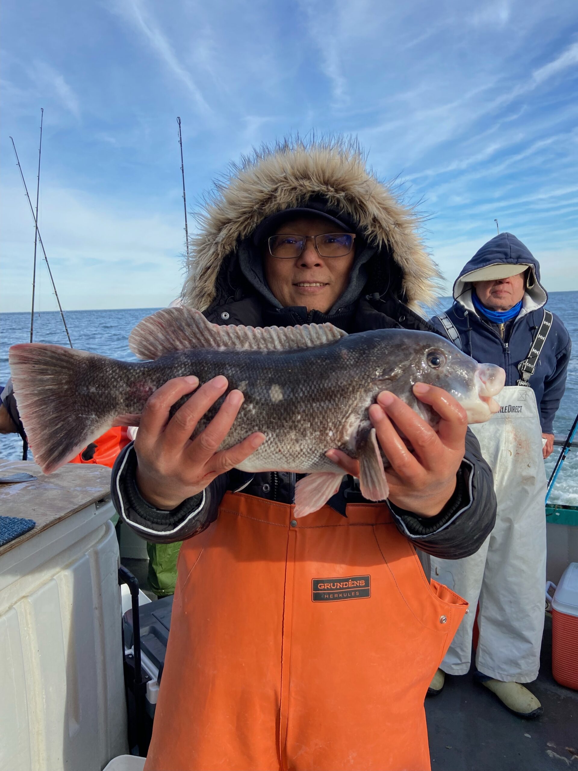 a person holding a fish