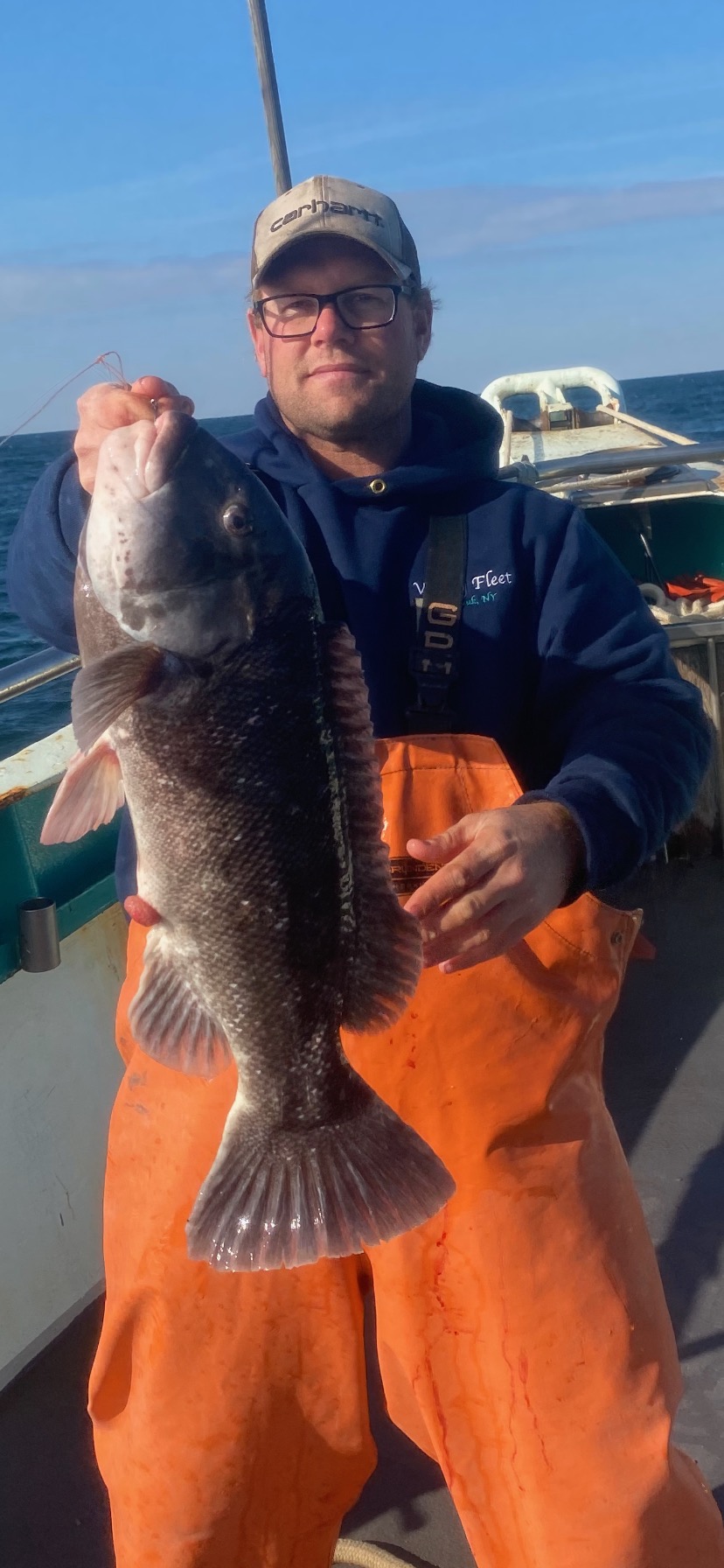 a man holding a fish