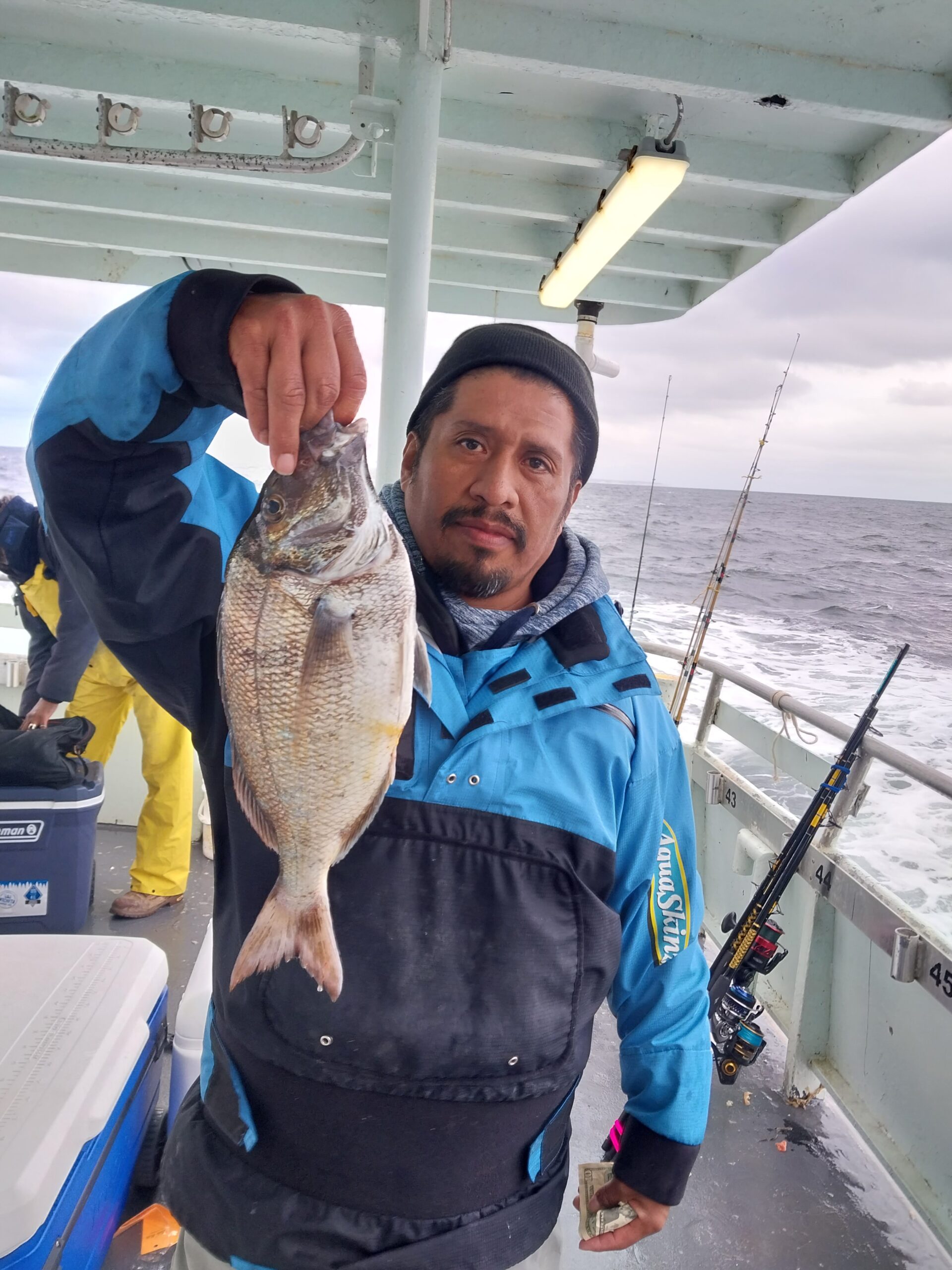 a man holding a fish