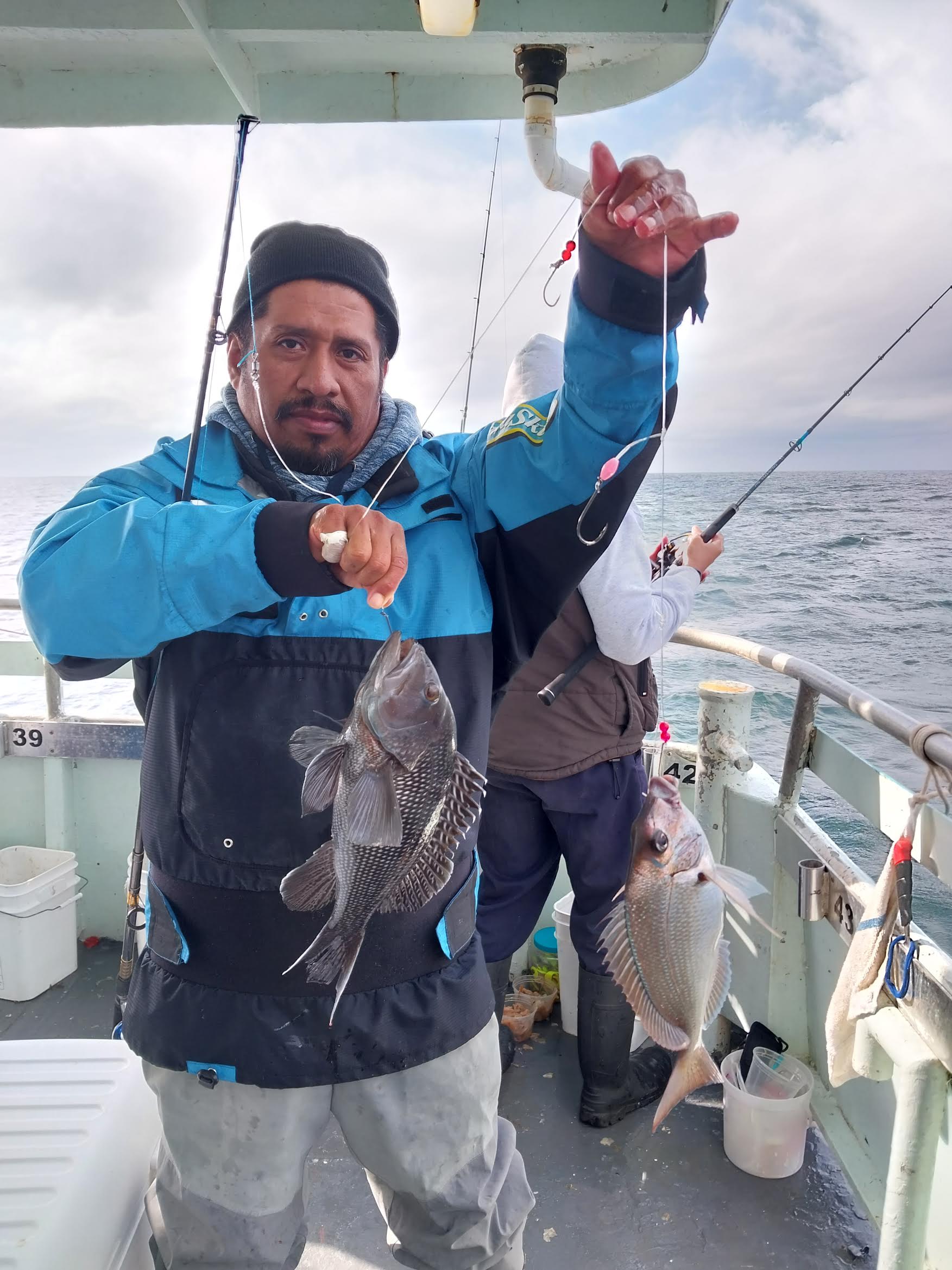 a person holding a fish in the water