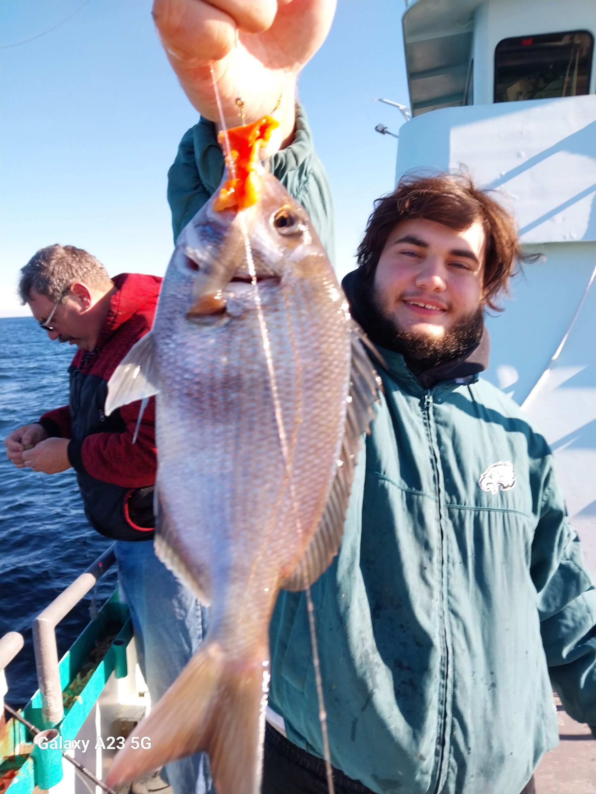 a man holding a fish