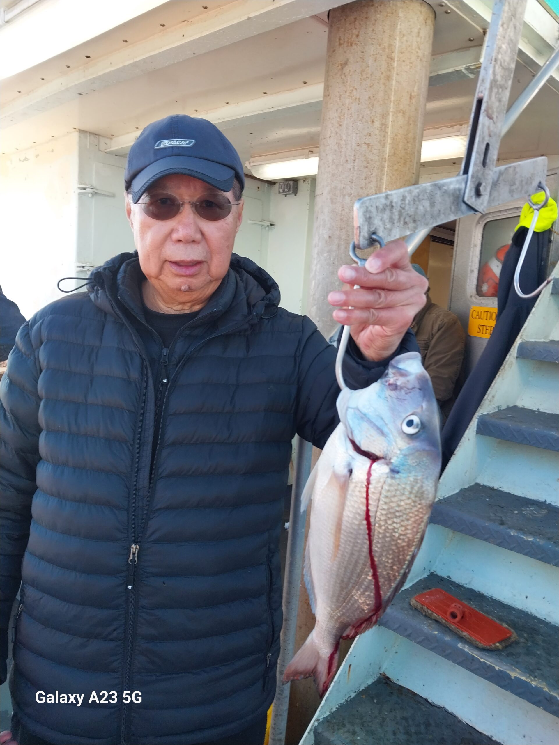 a man holding a fish