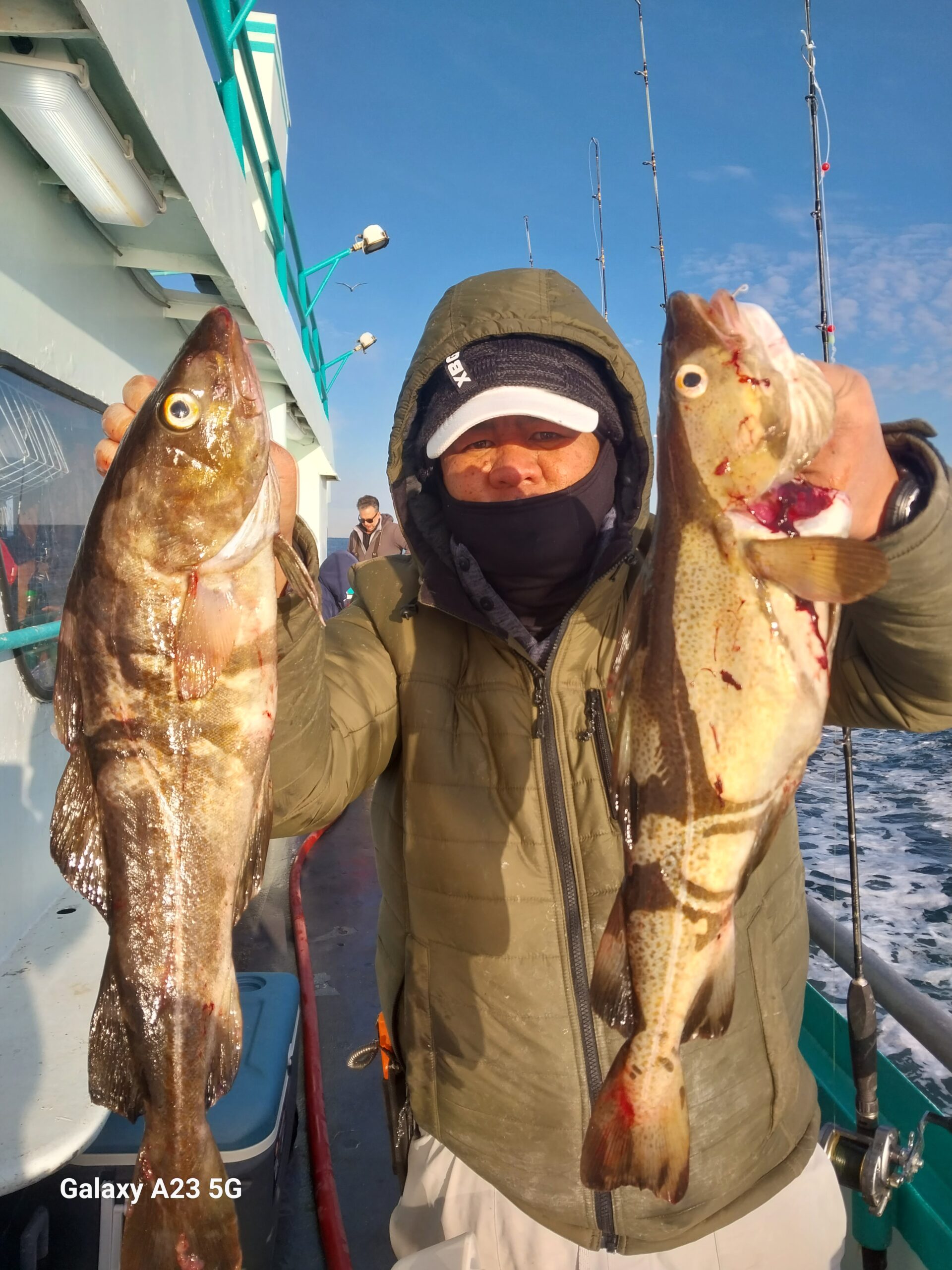 a person holding a fish