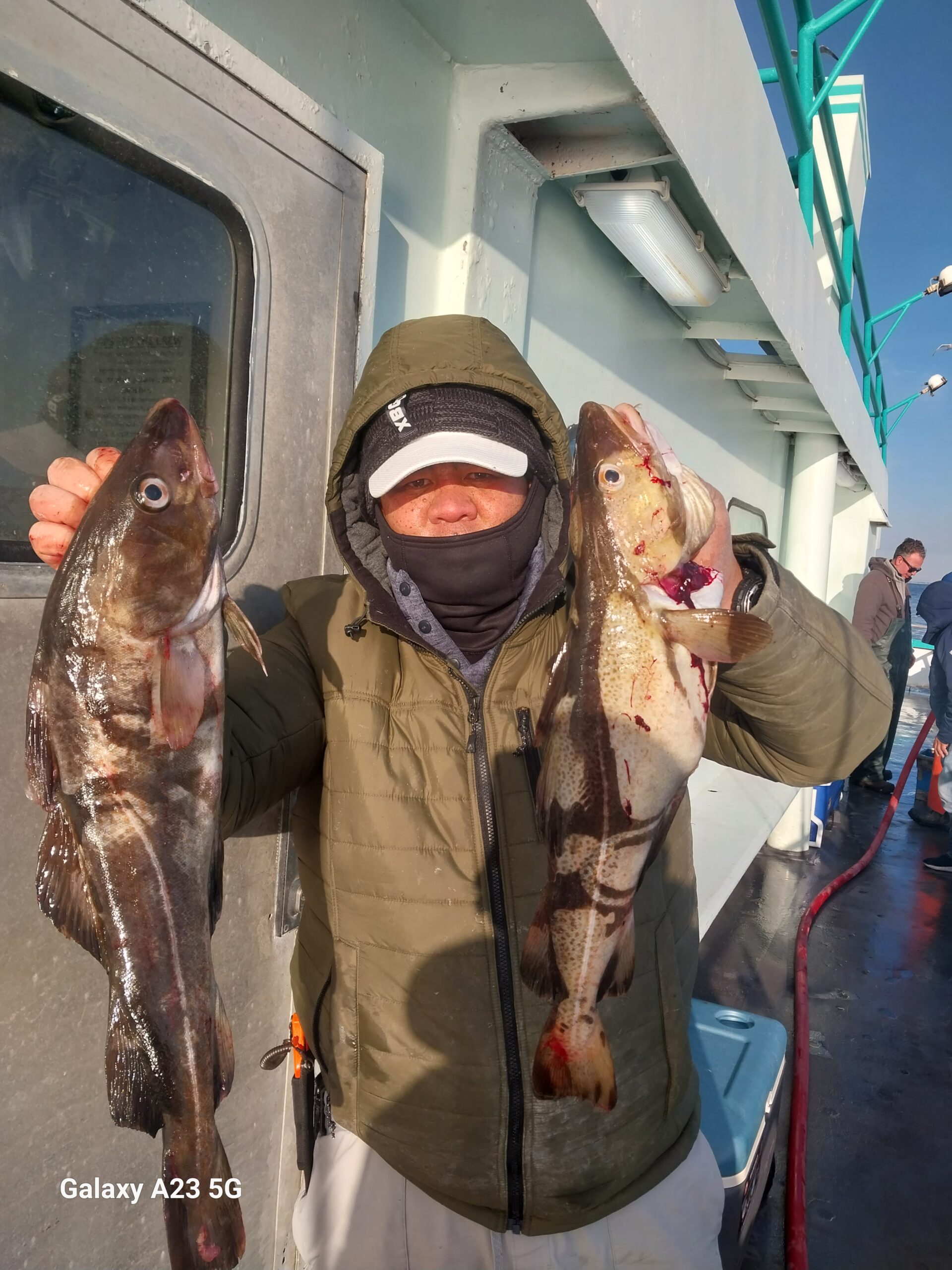 a person holding a fish