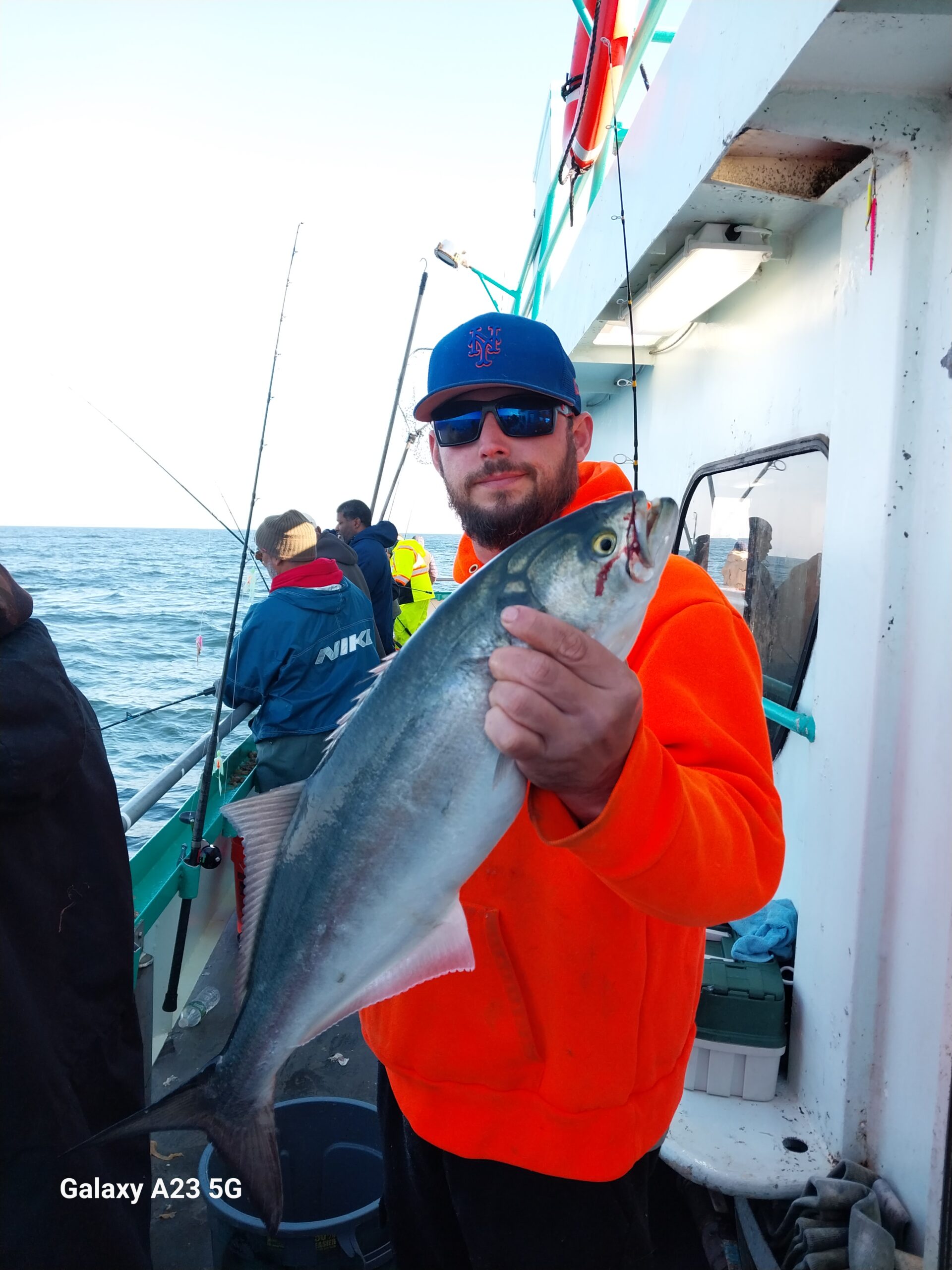 a man holding a fish