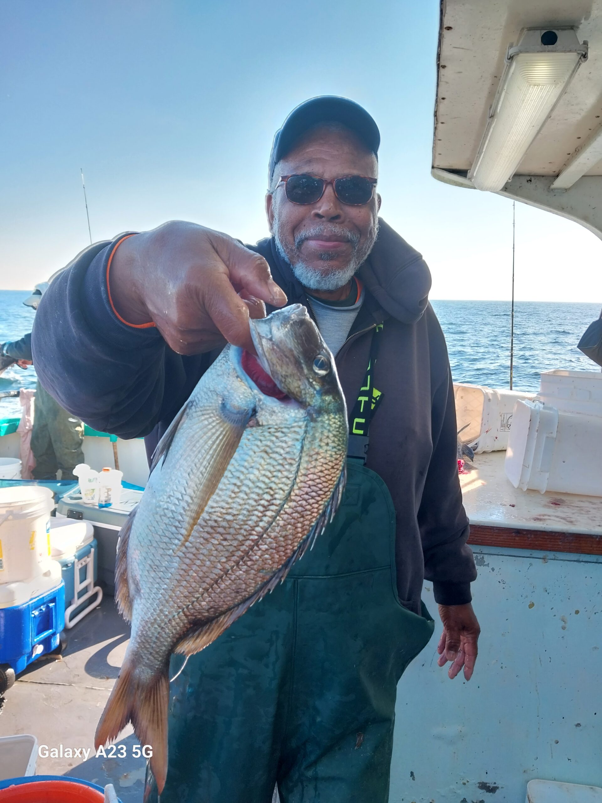 a man holding a fish