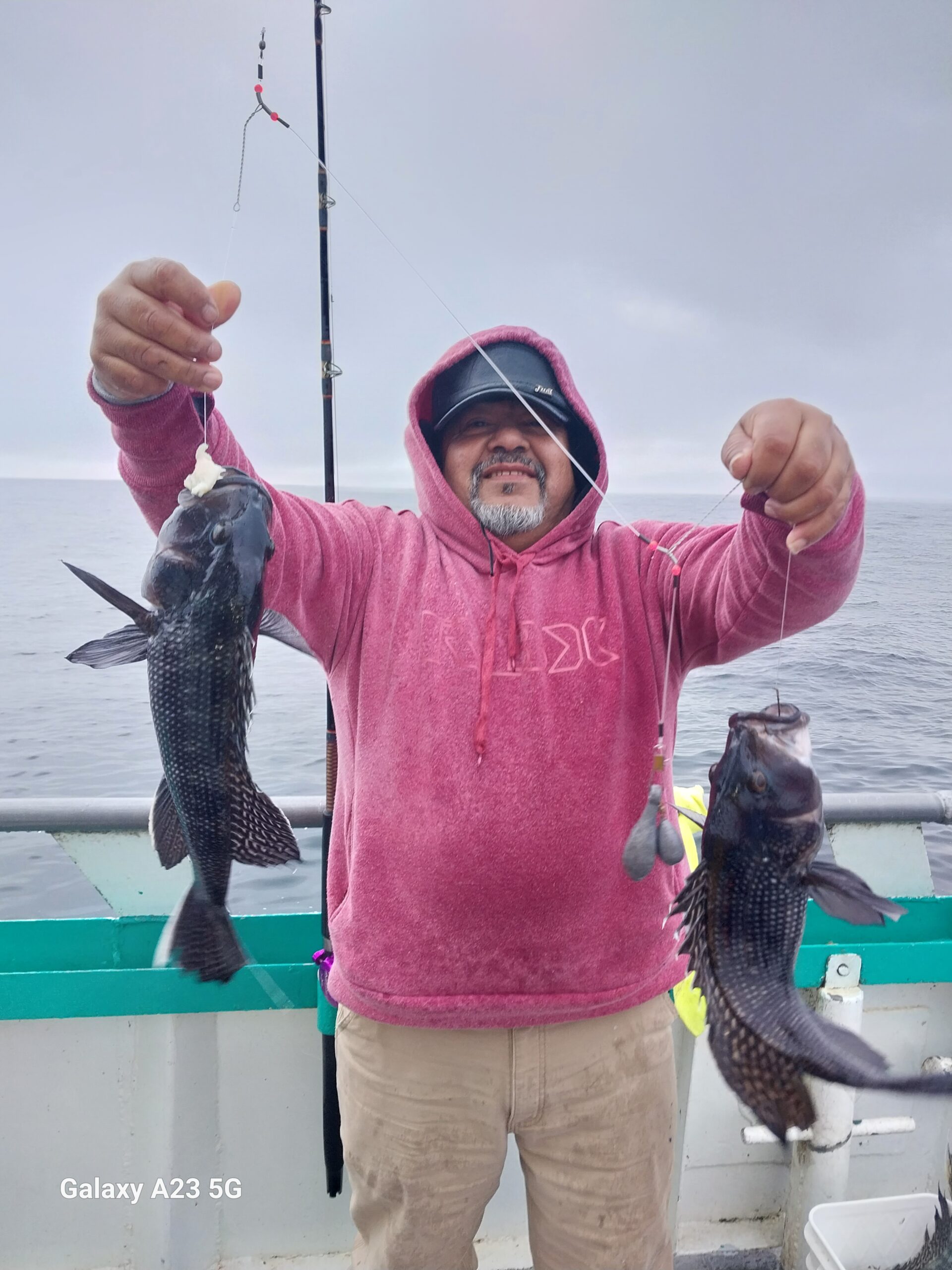 a person holding a fish