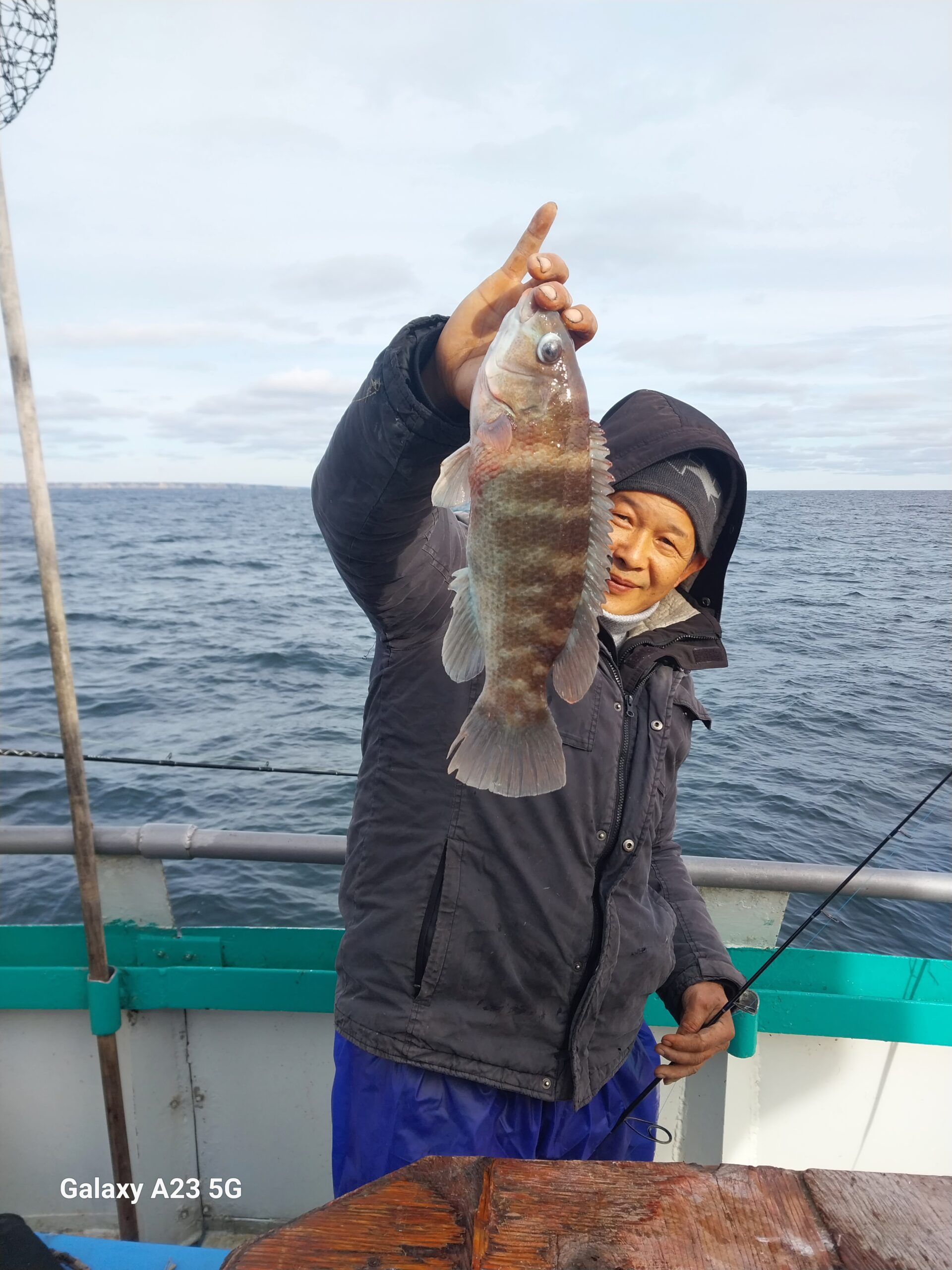 a person standing next to a body of water