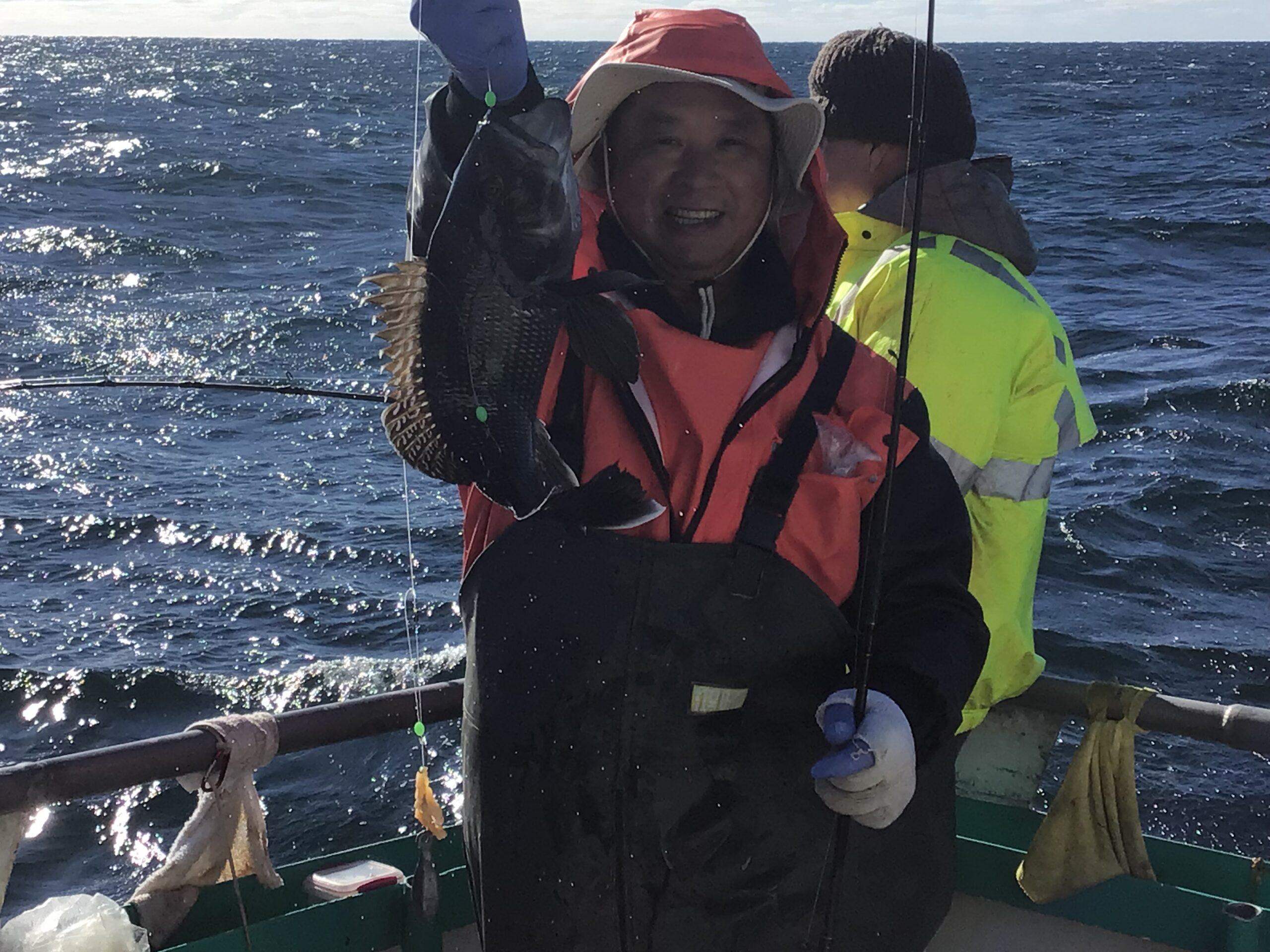 a person standing next to a body of water