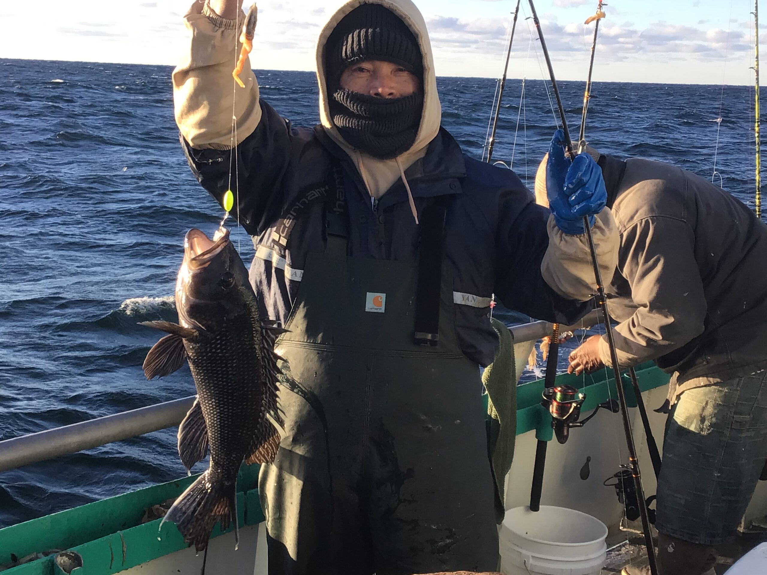 a man holding a fish in the water