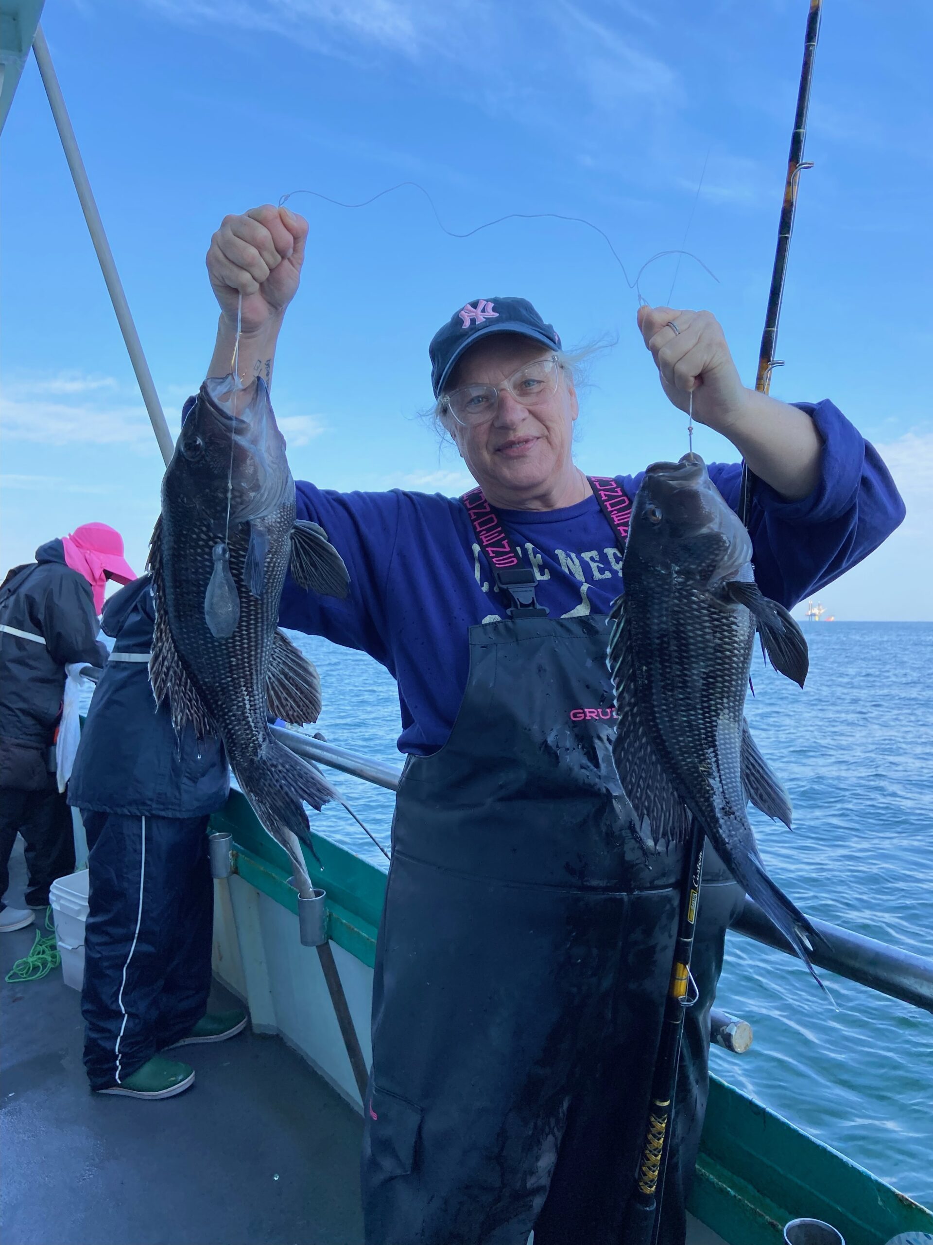 a person holding a fish