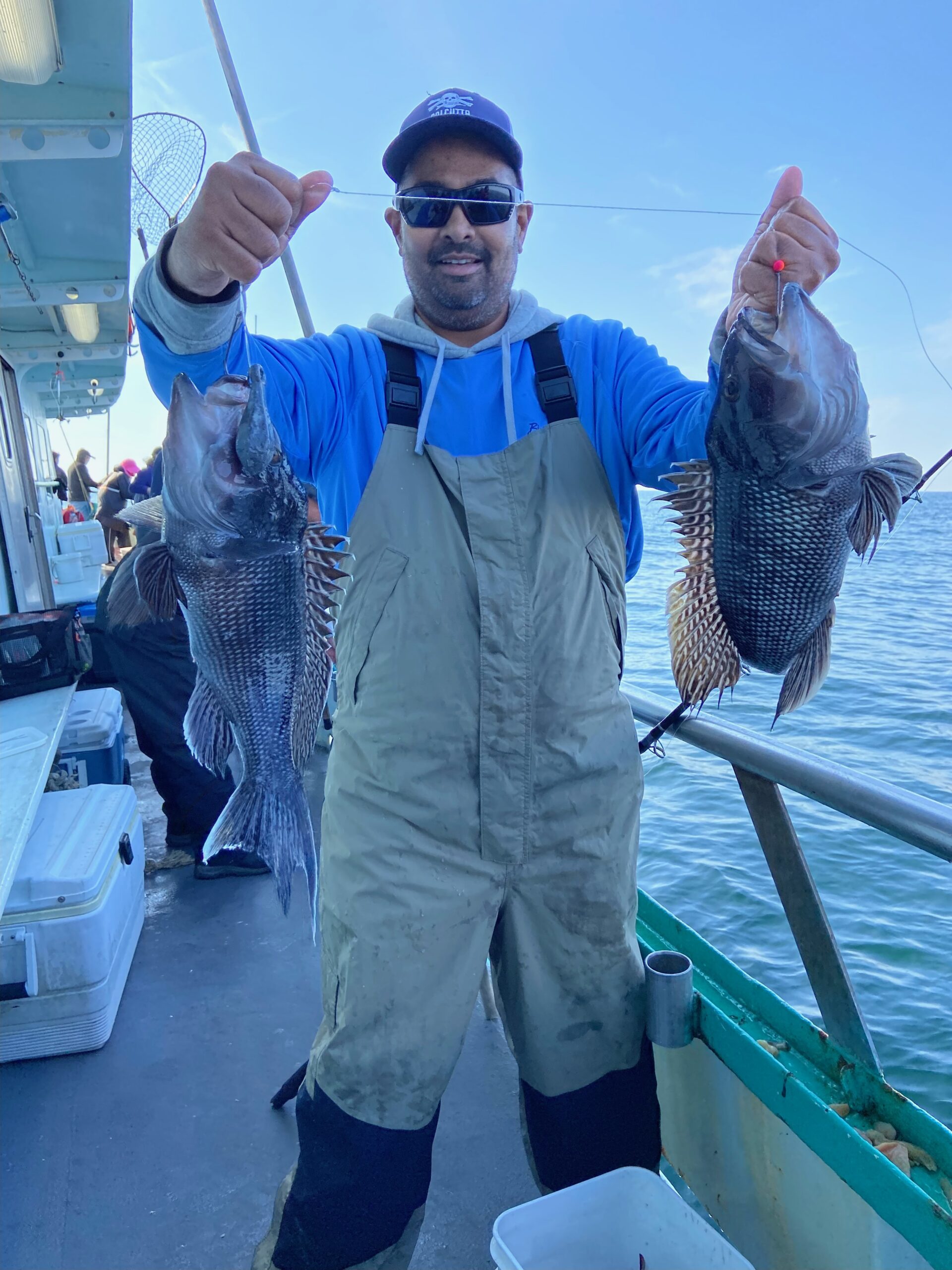 a man holding a fish