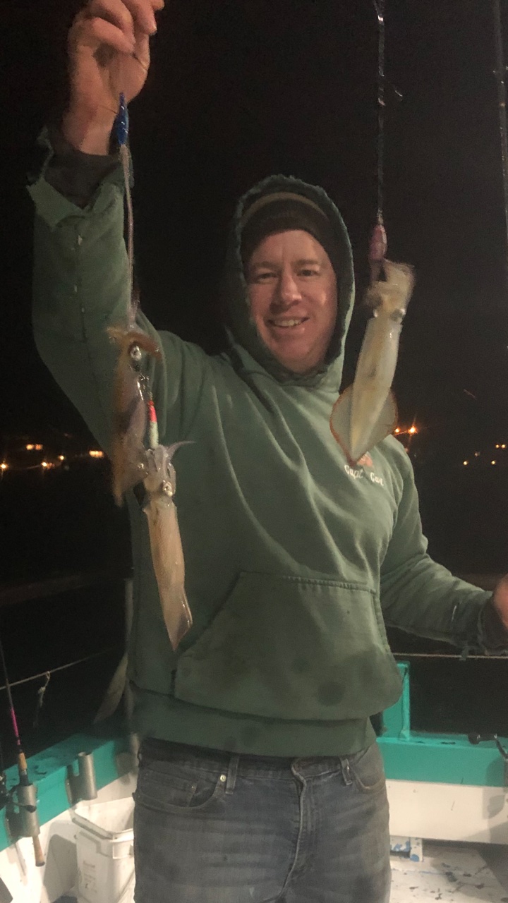 a person standing in front of a mirror posing for the camera