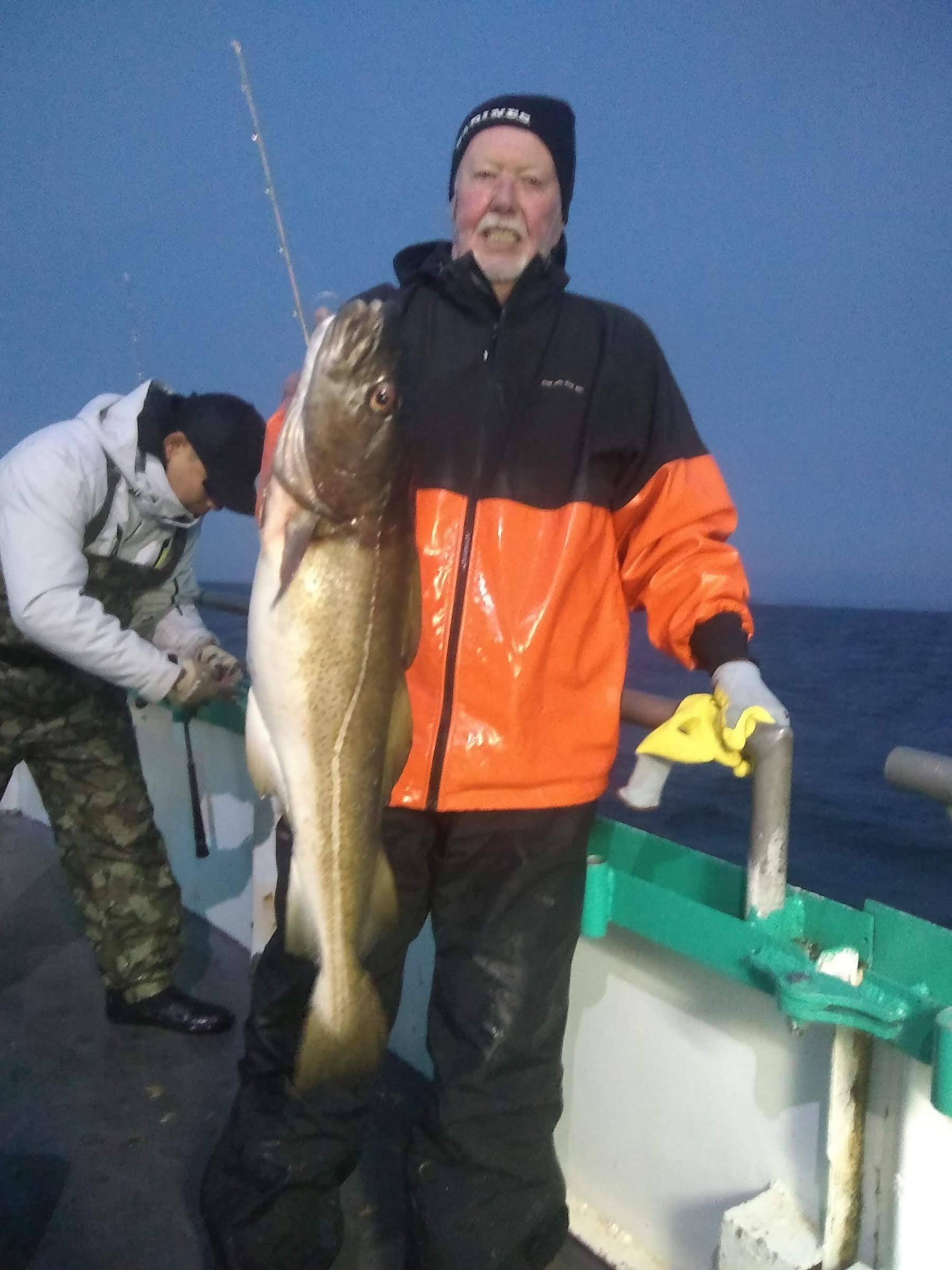 a man holding a fish