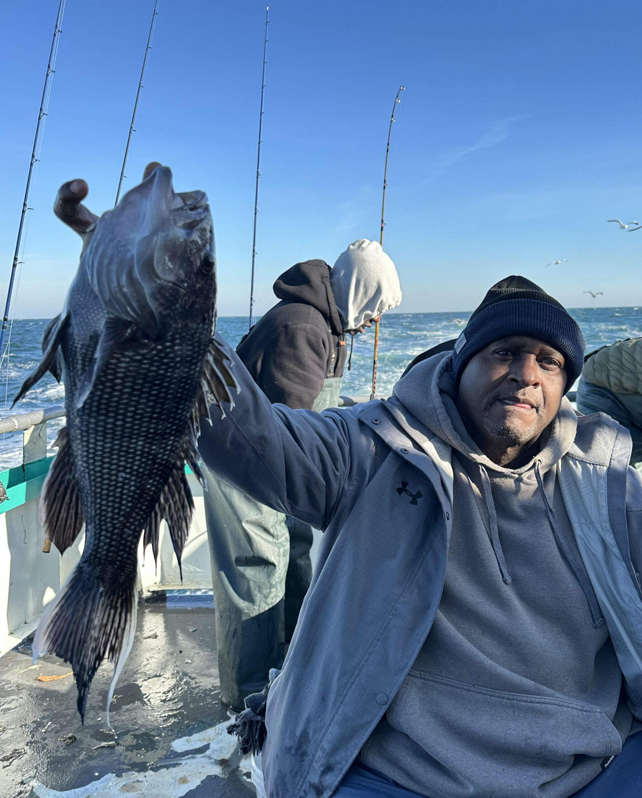 a man holding a fish