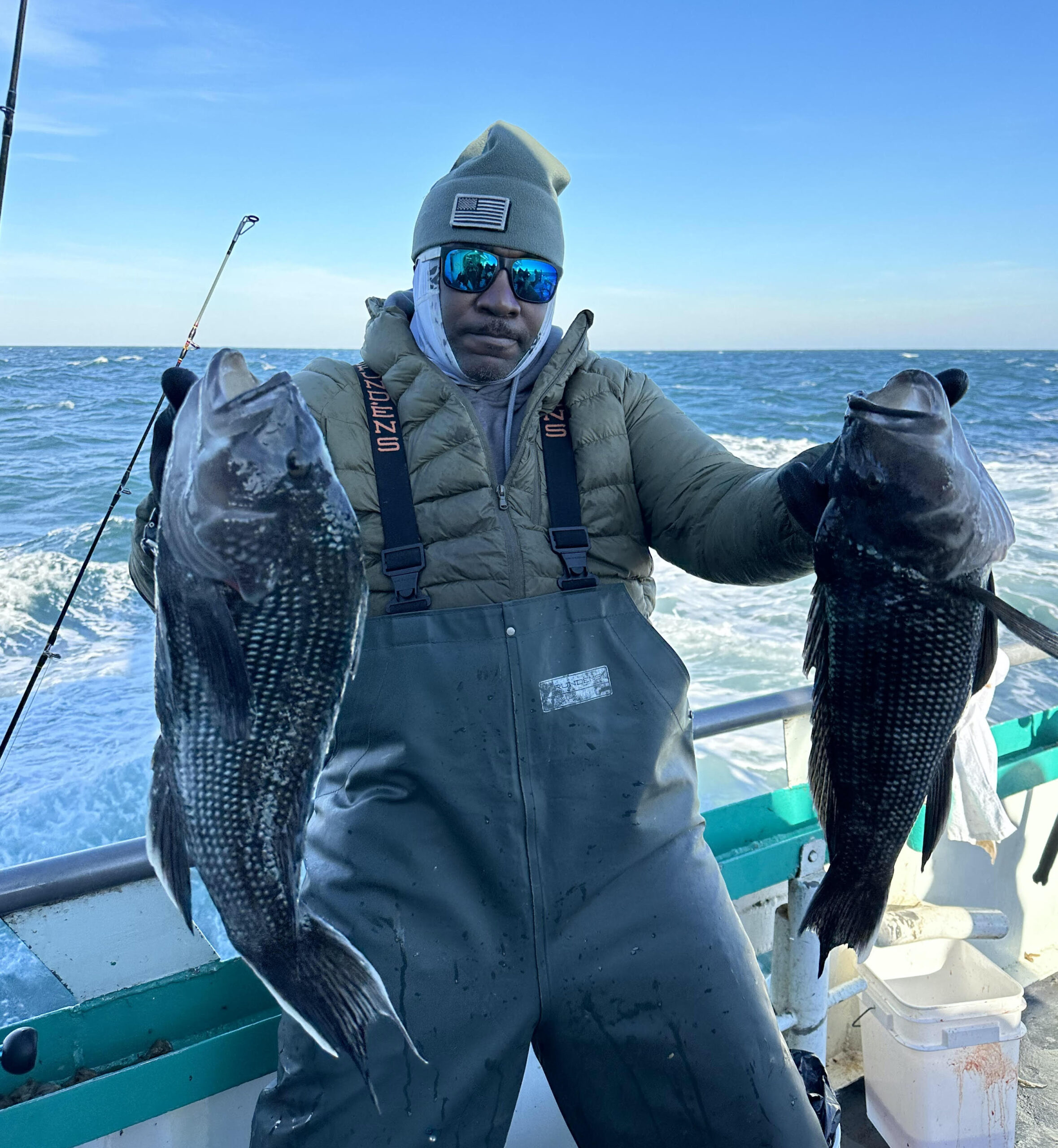 a person holding a fish in the water