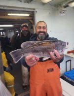 a man holding a fish