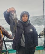 a couple of people that are standing in the water